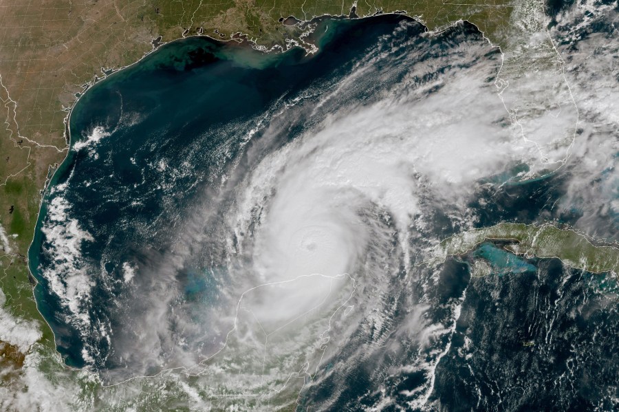 This GOES-16 GeoColor satellite image taken at 12:15 p.m. EDT and provided by National Oceanic and Atmospheric Administration (NOAA) shows Hurricane Milton in the Gulf of Mexico, off the coast off Mexico’s Yucatan Peninsula Tuesday, Oct. 8, 2024. (NOAA via AP)