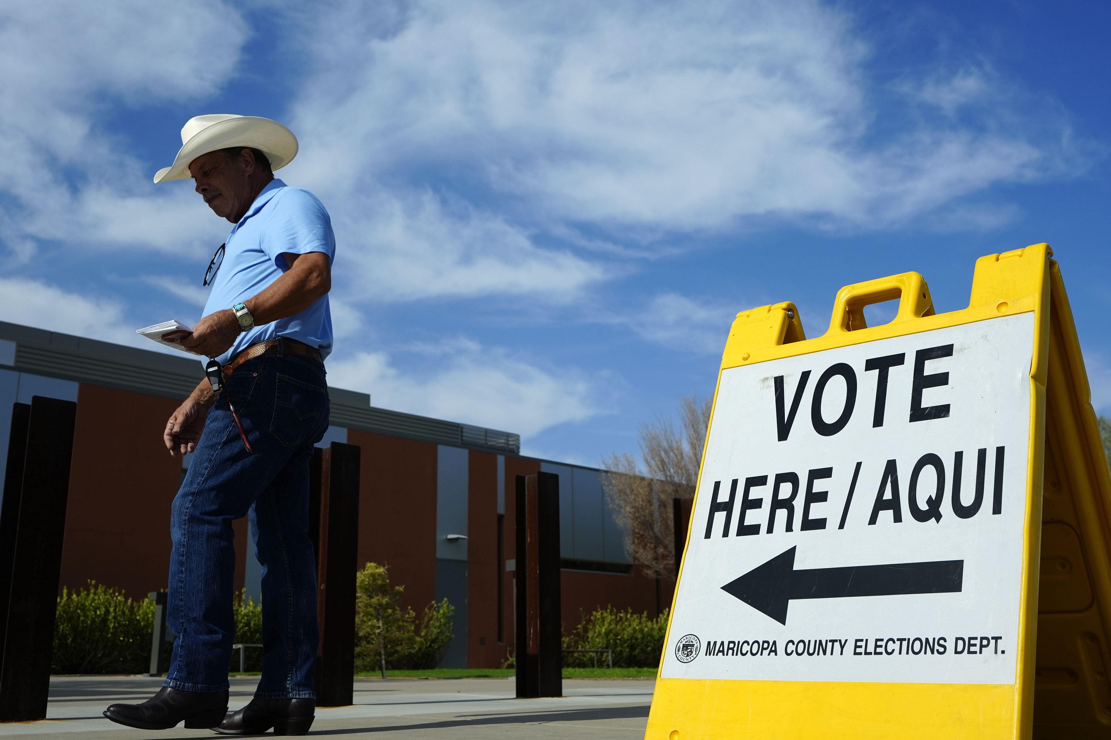 FILE - A voter walks to a voting precinct prior to casting his ballot in the state's primary election, Tuesday, July 30, 2024, in El Mirage, Ariz. (AP Photo/Ross D. Franklin, File)