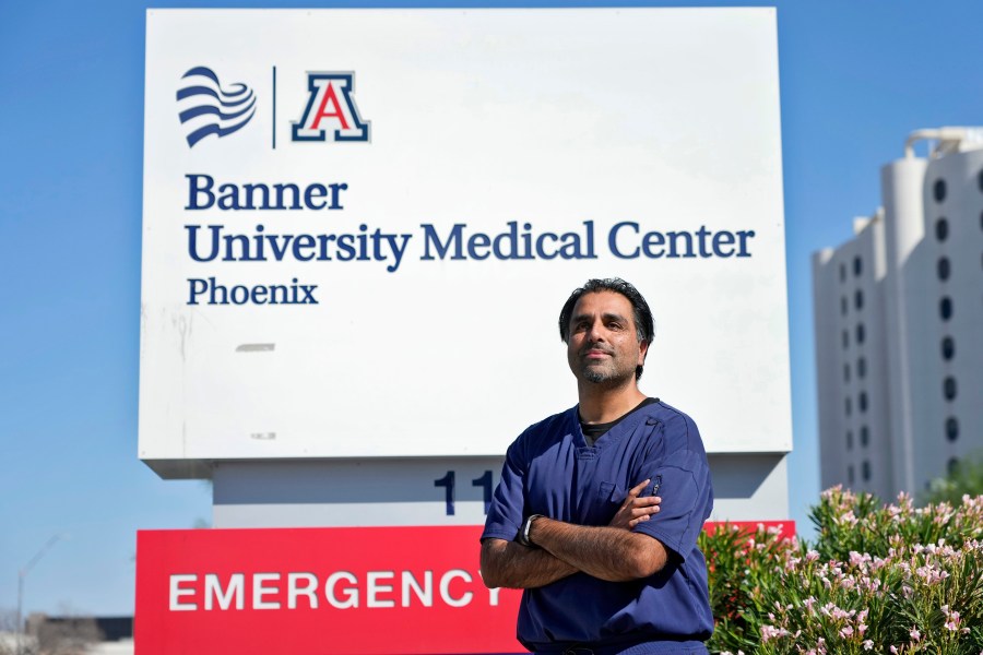 Dr. Aneesh Naran stands outside the Banner University Medical Center emergency room after his shift, Monday, Oct. 7, 2024 in Phoenix. (AP Photo/Matt York)