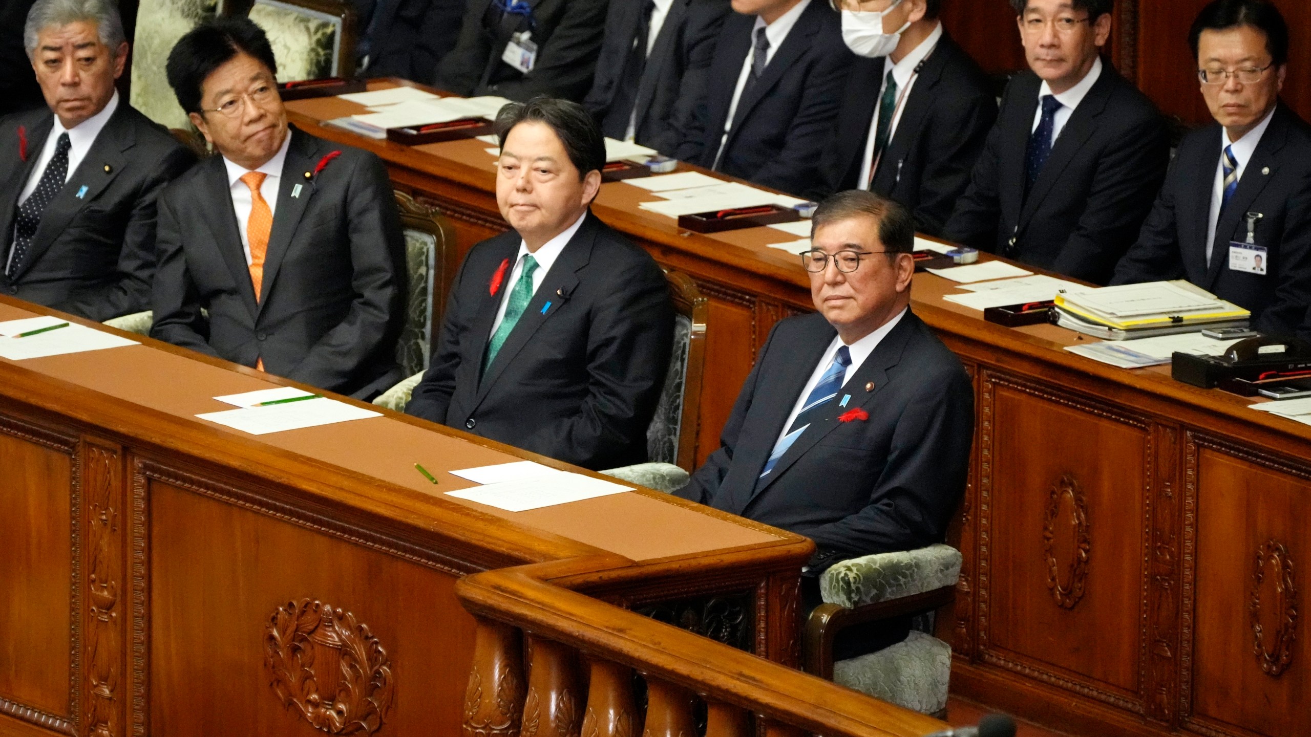 Japanese Prime Minister Shigeru Ishiba, right, attends an extraordinary Diet session at the lower house of parliament Wednesday, Oct. 9, 2024, in Tokyo. (AP Photo/Eugene Hoshiko)