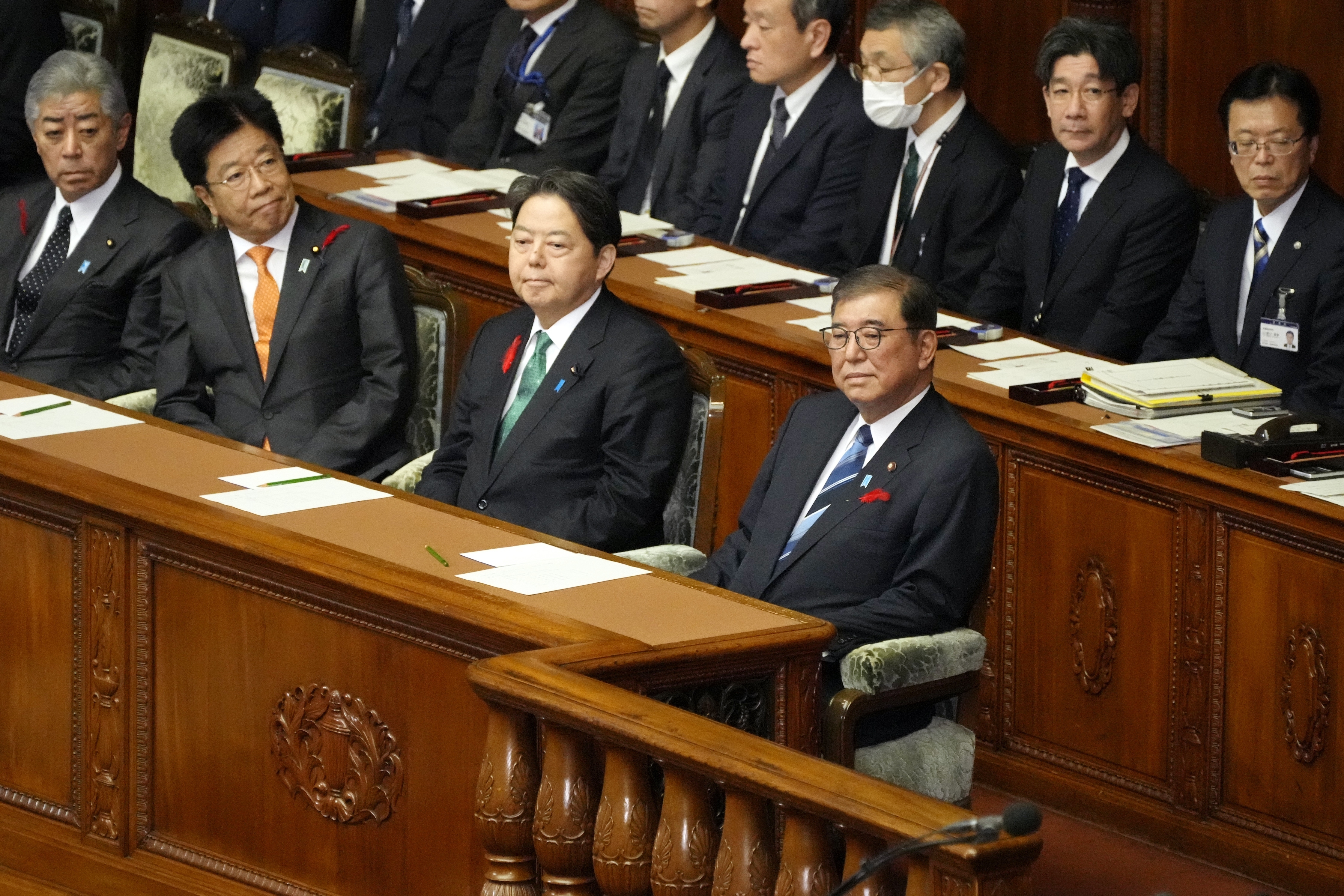 Japanese Prime Minister Shigeru Ishiba, right, attends an extraordinary Diet session at the lower house of parliament Wednesday, Oct. 9, 2024, in Tokyo. (AP Photo/Eugene Hoshiko)