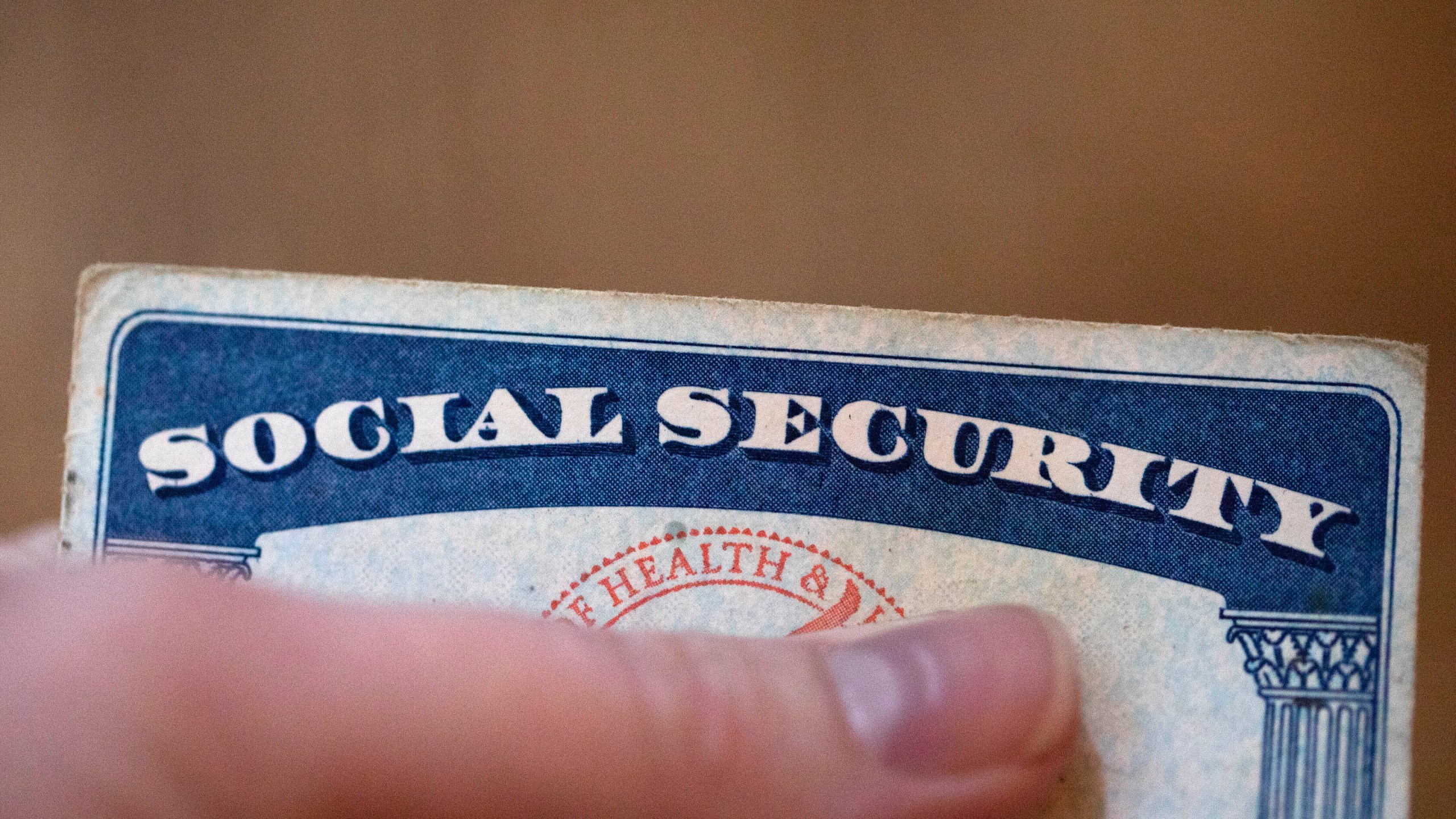 FILE - A Social Security card is displayed on Oct. 12, 2021, in Tigard, Ore. (AP Photo/Jenny Kane, File)