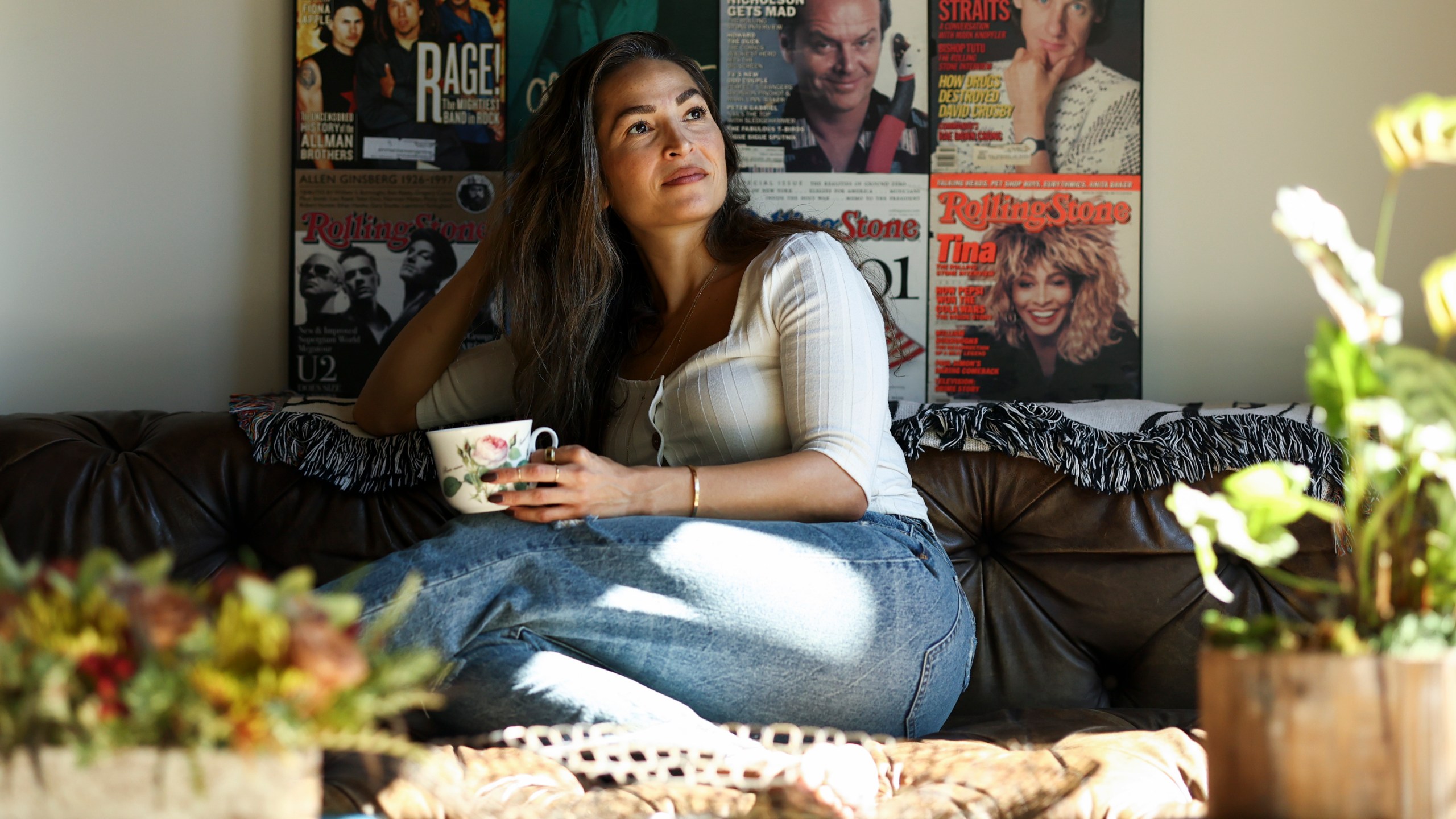 Headspace meditation teacher, Rosie Acosta, looks on in her living room Monday, Sept. 30, 2024, in Woodland Hills, Calif. (AP Photo/Jessie Alcheh)