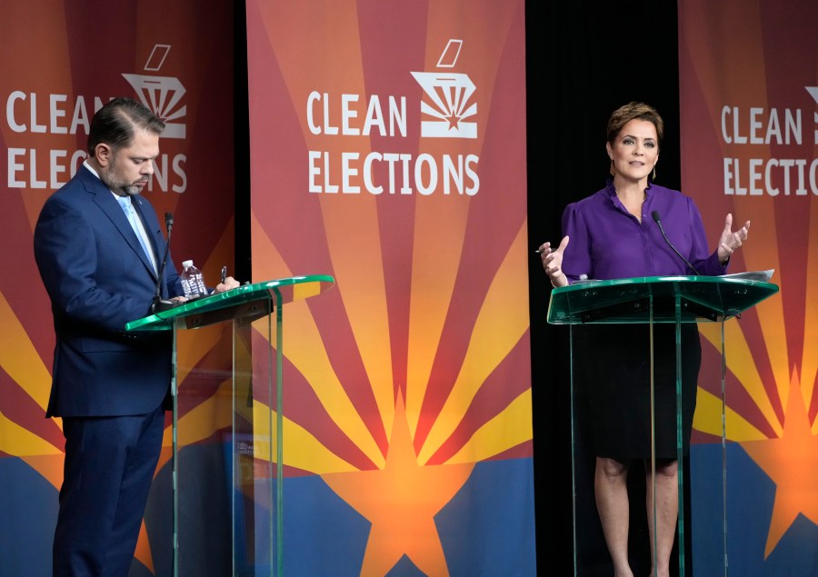 U.S. Senate candidates Rep. Ruben Gallego, D-Ariz., left, and Republican challenger Kari Lake participate in their debate, Wednesday, Oct. 9, 2024, in Phoenix. (Cheryl Evans/Arizona Republic via AP)