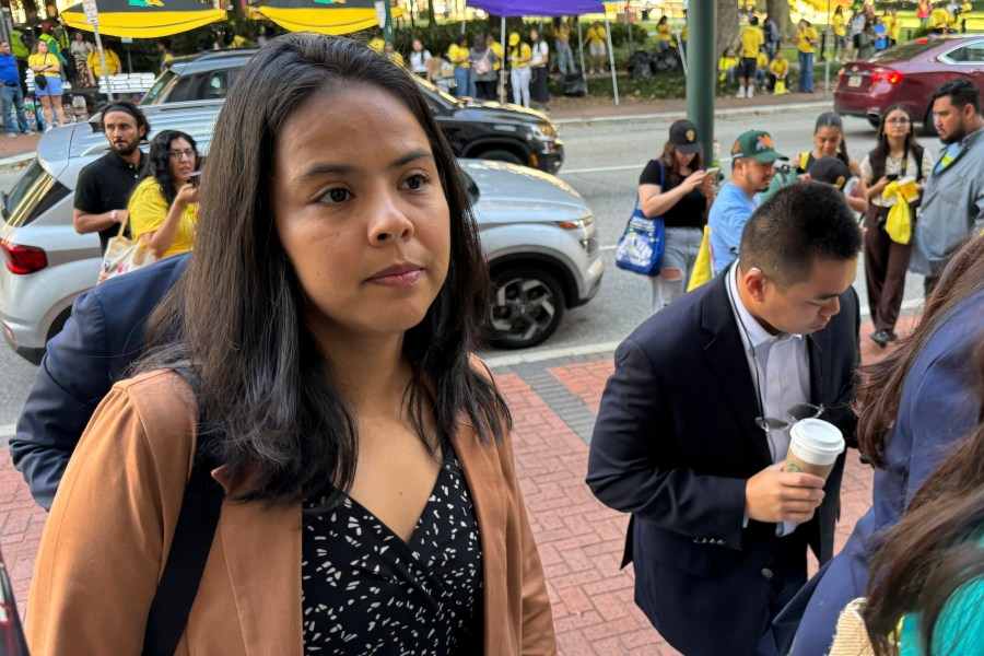 DACA-recipient María Rocha-Carrillo, 37, arrives in federal appellate court in New Orleans on Thursday, Oct. 10, 2024 to hear lawyers debate the future of the policy that has allowed her and hundreds of thousands of others to remain in the U.S. legally. (AP Photo/Jack Brook)