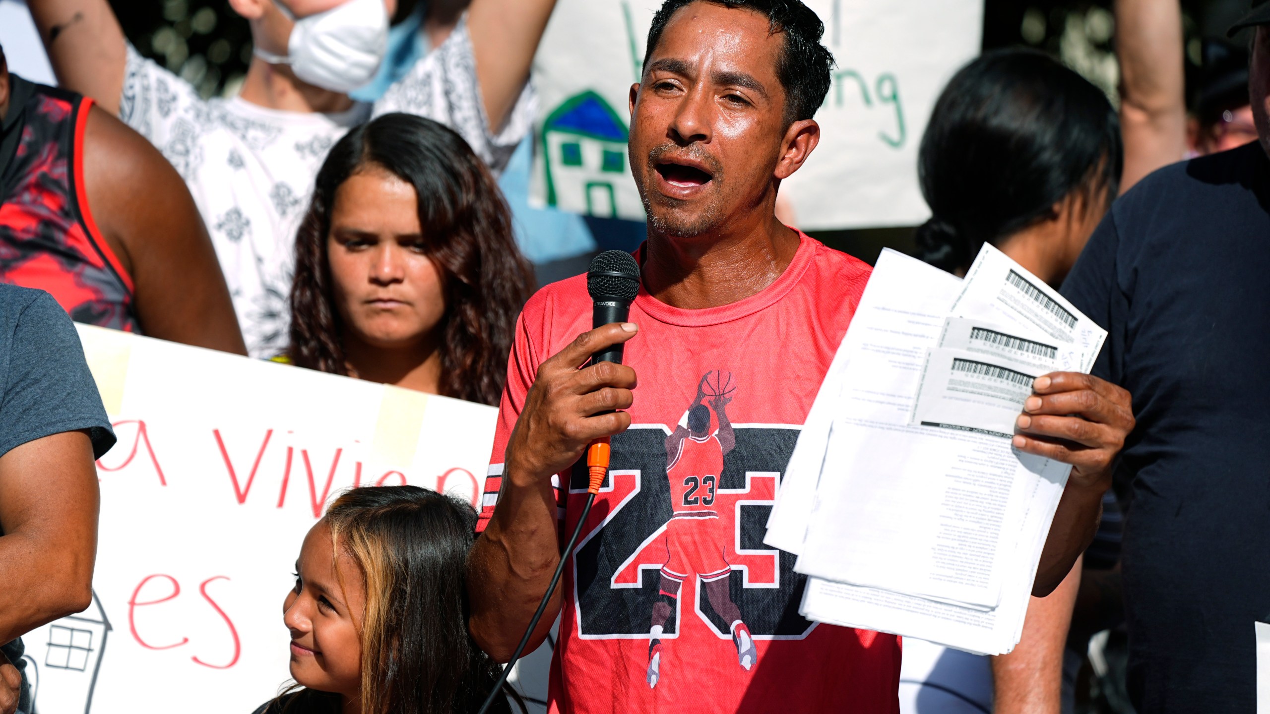 FILE - Juan Carlos Jimenez speaks during a rally by the East Colfax Community Collective to address chronic problems in the apartment buildings occupied by people displaced from their home countries in central and South America Sept. 3, 2024, in Aurora, Colo. (AP Photo/David Zalubowski, File)