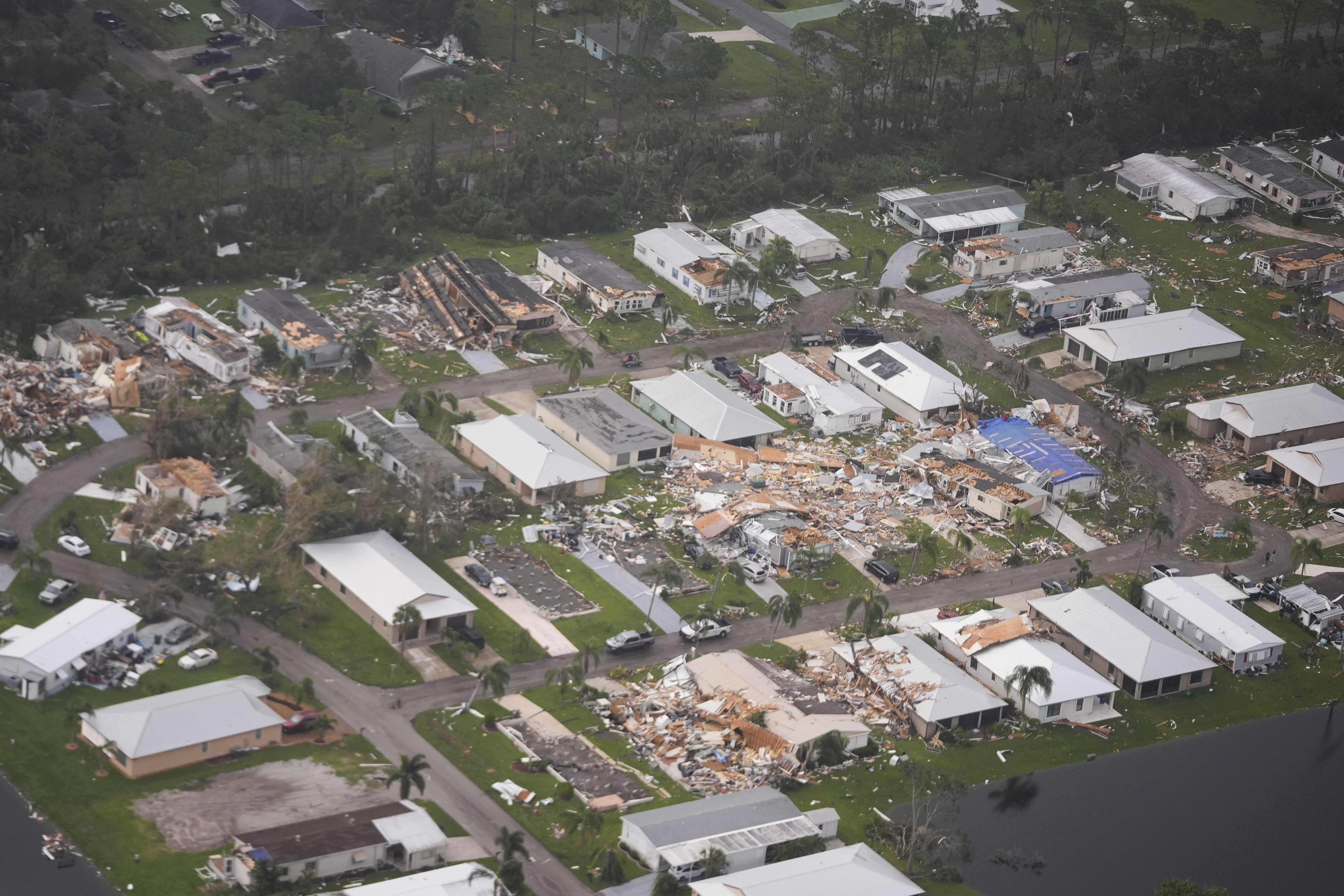 Neighborhoods destroyed by tornadoes are seen in this aerial photo in the aftermath of Hurricane Milton, Thursday, Oct. 10, 2024, in Fort Pierce, Fla. (AP Photo/Gerald Herbert)