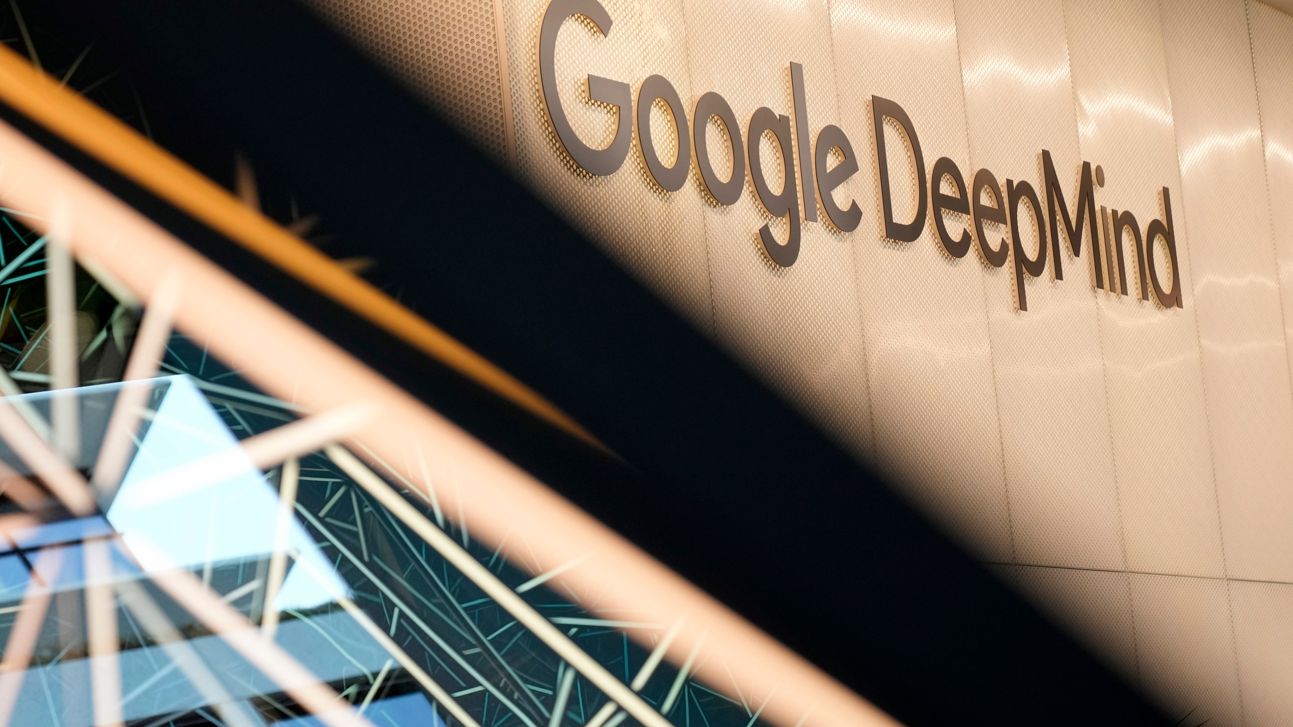 View at the Google DeepMind logo at the office building in London, Wednesday, Oct. 9, 2024. Demis Hassabis and John Jumper were awarded the Nobel Prize in chemistry for their breakthrough work predicting and designing the structure of proteins, the building blocks of life. Hassabis and Jumper both work at Google Deepmind in London. (AP Photo/Alastair Grant)