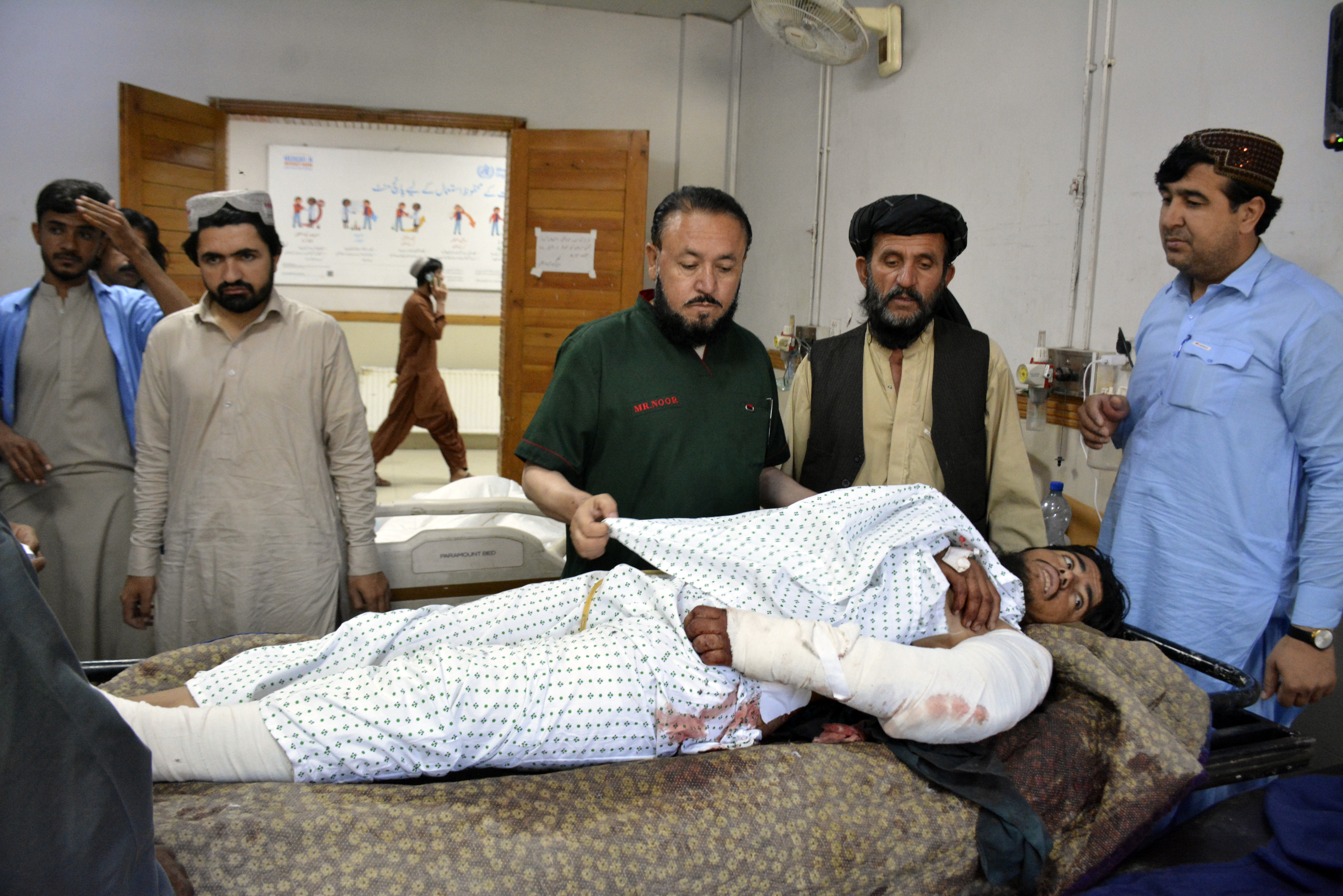 An injured man receives treatment at a hospital in Quetta, Pakistan, Friday, Oct. 11, 2024, following Thursday attack by gunmen in Balochistan province. (AP Photo/Arshad Butt)