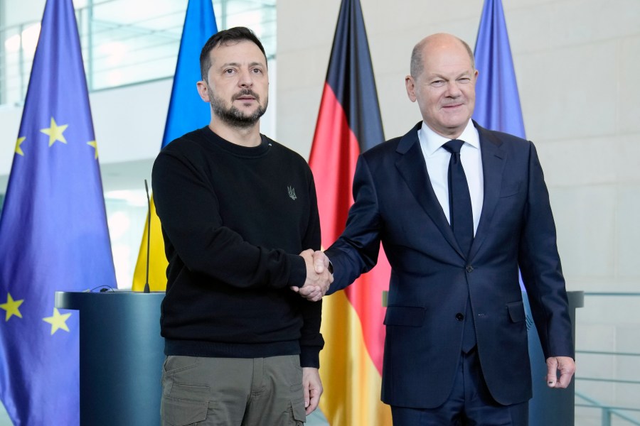 Ukraine's president Volodymyr Zelenskyy and German chancellor Olaf Scholz shake hands at the chancellery in Berlin, Germany, Friday, Oct. 11, 2024. (AP Photo/Ebrahim Noroozi)