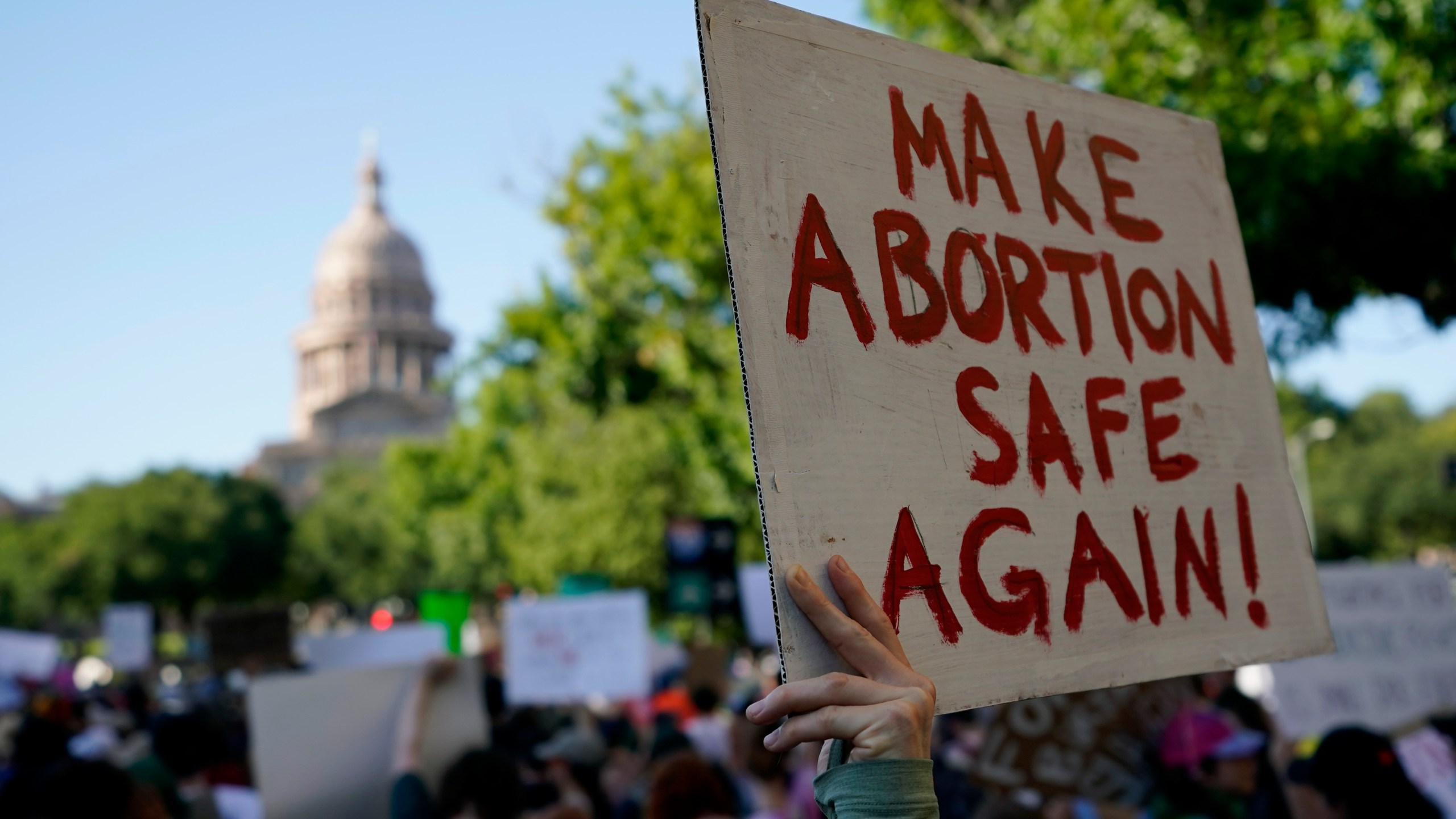 FILE - Demonstrators march and gather near the Texas Capitol following the U.S. Supreme Court's decision to overturn Roe v. Wade, June 24, 2022, in Austin, Texas. (AP Photo/Eric Gay, File)