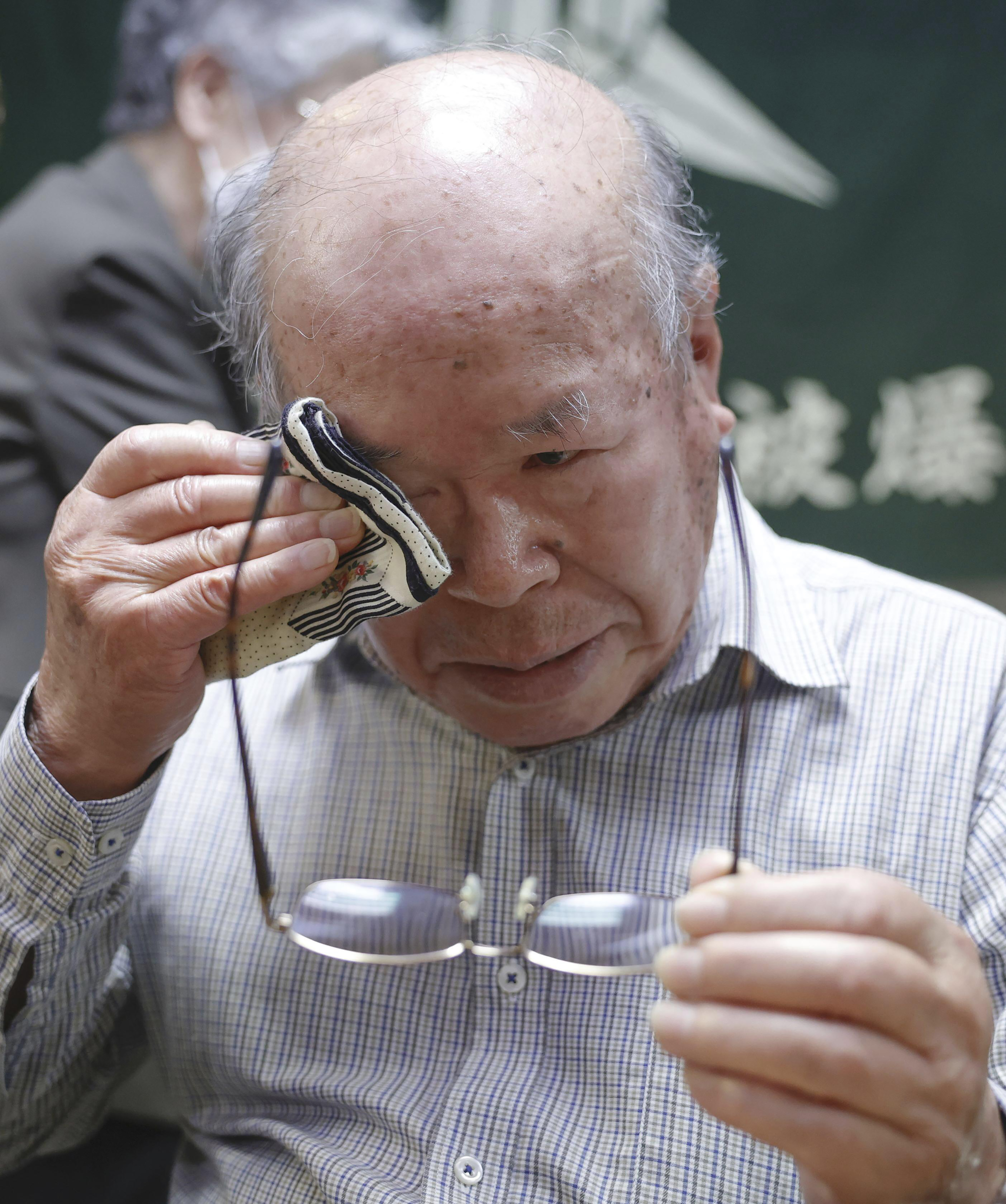 Shigemitsu Tanaka, the chairman of Nagasaki Atomic bomb Survivors Council, cries during a press conference, in Nagasaki, western Japan, Friday, Oct. 11, 2024, after Nihon Hidankyo, or the Japan Confederation of A- and H-Bomb Sufferers Organizations, won the Nobel Peace Prize.(Kyodo News via AP)