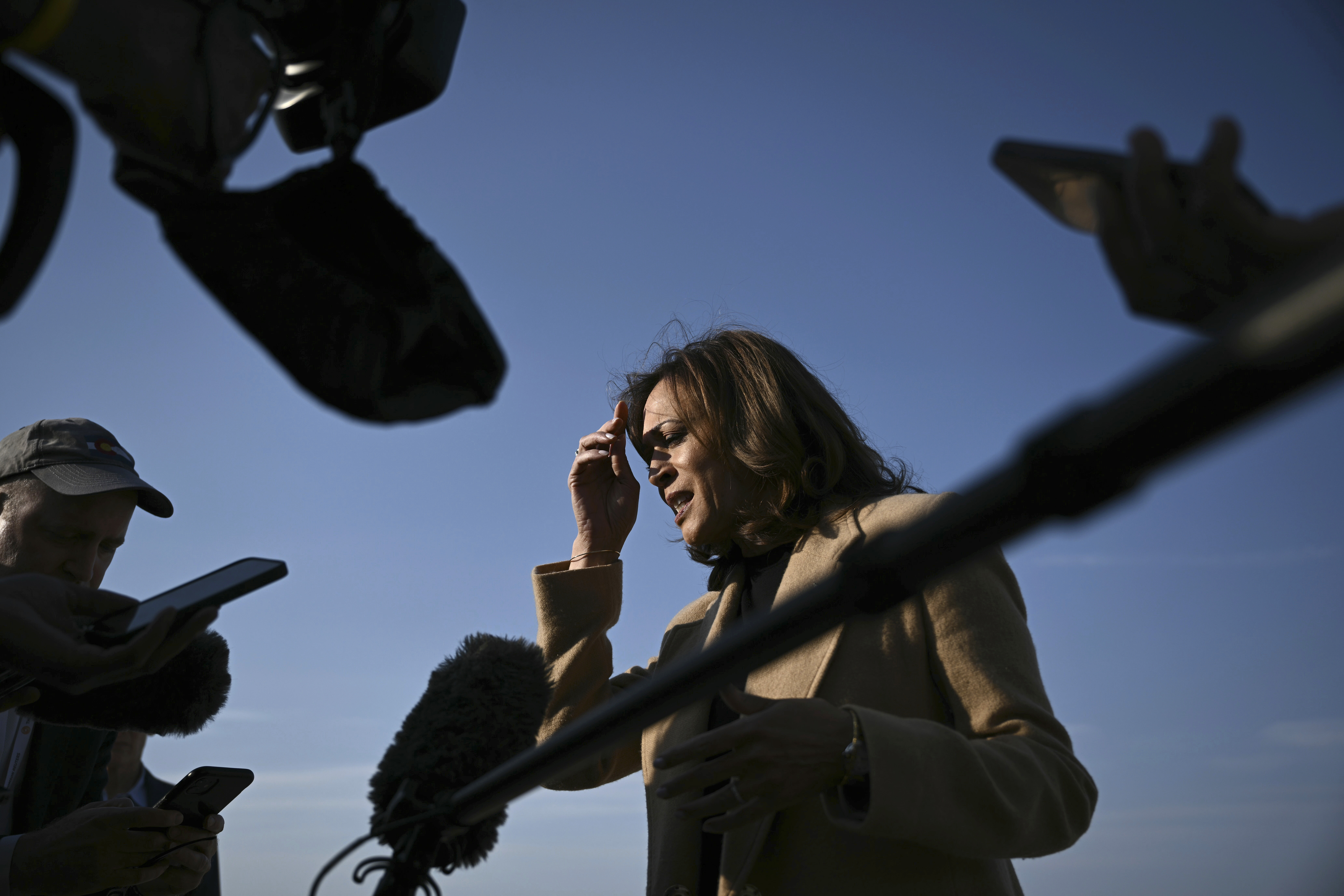 Democratic presidential nominee Vice President Kamala Harris speaks to the press before boarding Air Force Two at Joint Base Andrews, Md., Saturday, Oct. 12, 2024, en route to North Carolina for a campaign event. (Brendan Smialowski/Pool via AP)