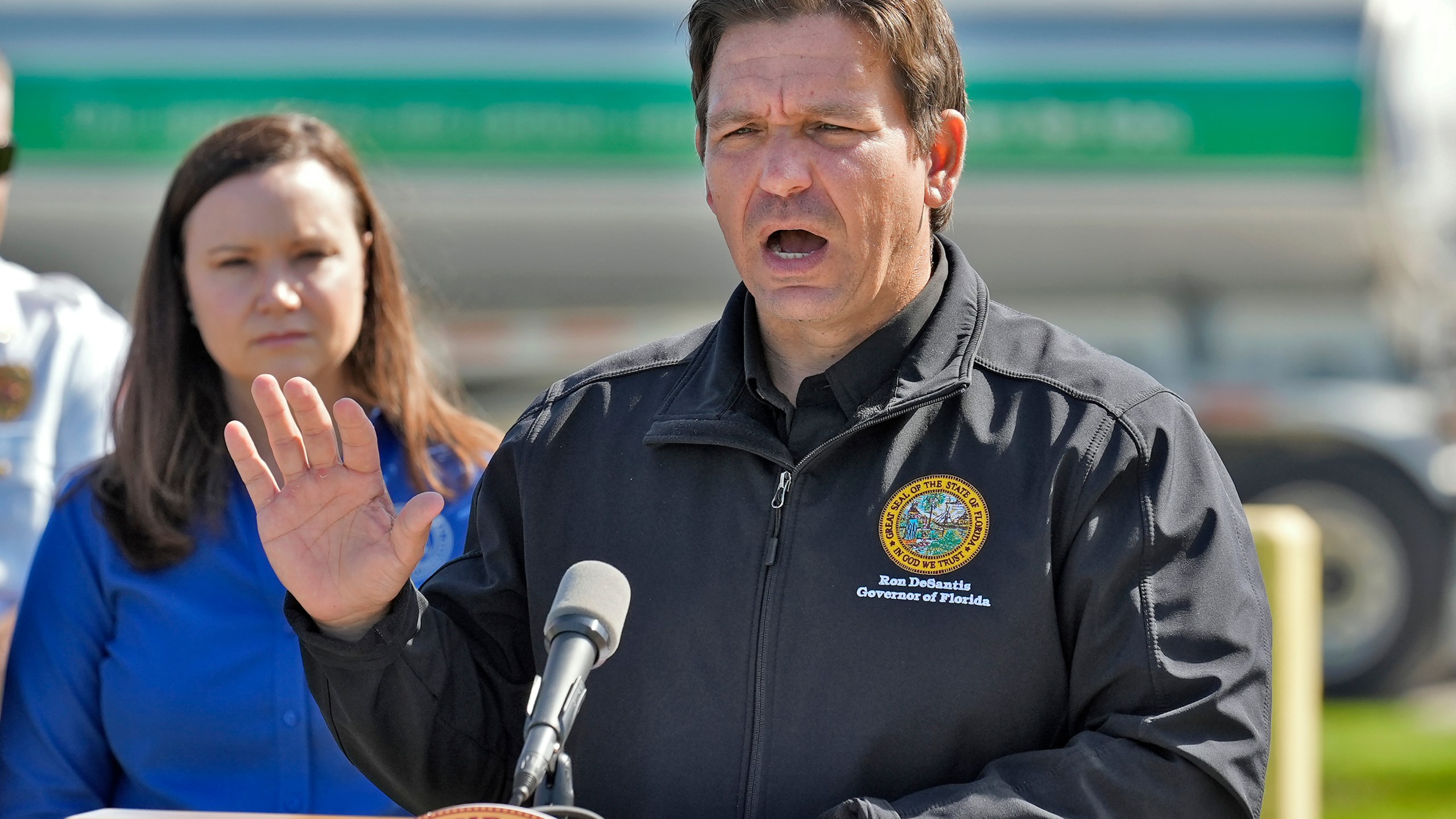 Florida Gov. Ron DeSantis holds a news conference at a fuel depot in Plant City, Fla., Saturday, Oct. 12, 2024, accompanied by Florida Attorney General Ashley Moody, right. Gas station are slow to open after the effects of Hurricane Milton. (AP Photo/Chris O'Meara)