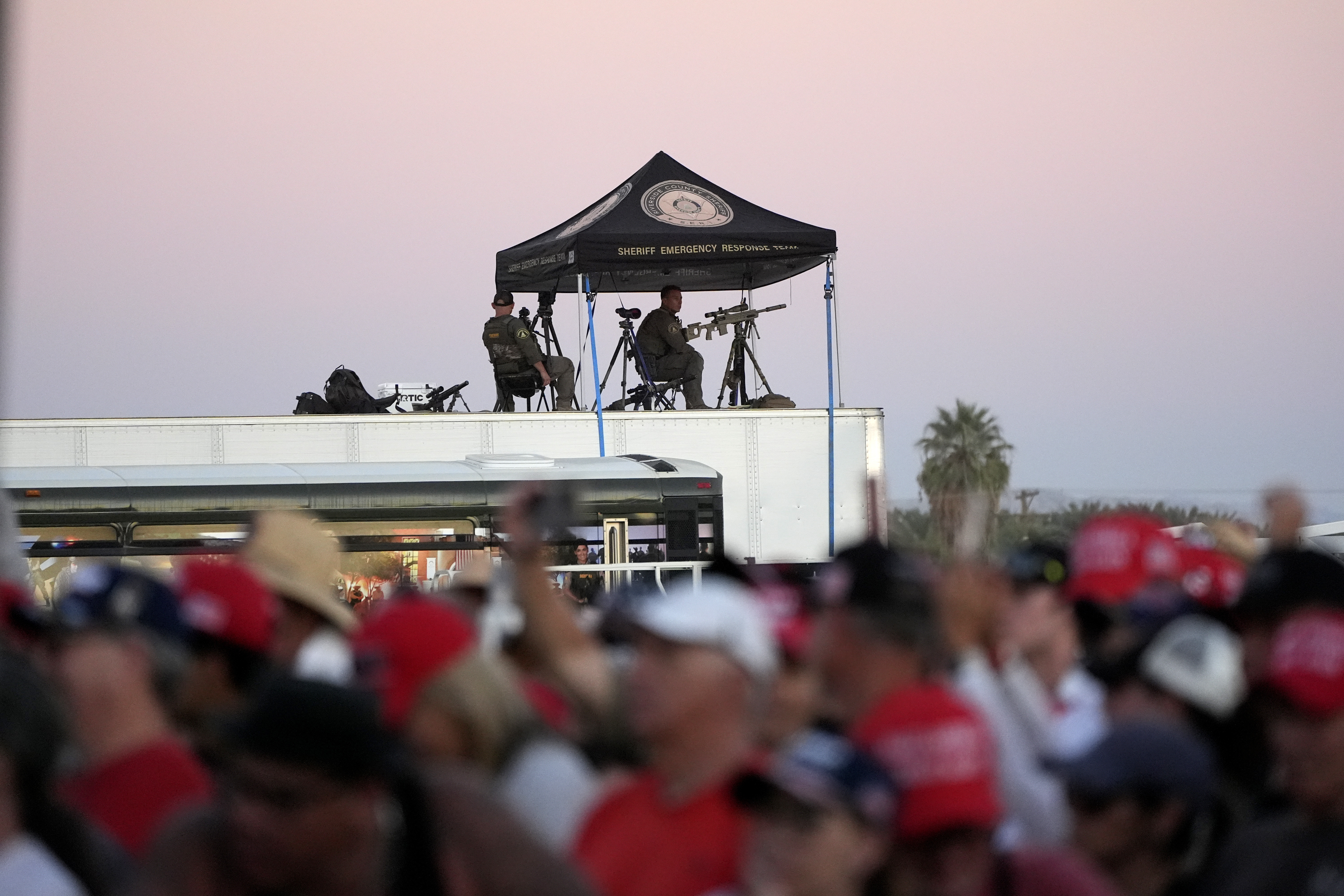 Law enforcement snipers look over the scene as Republican presidential nominee former President Donald Trump speaks at a campaign rally at the Calhoun Ranch, Saturday, Oct. 12, 2024, in Coachella, Calif. (AP Photo/Alex Brandon)