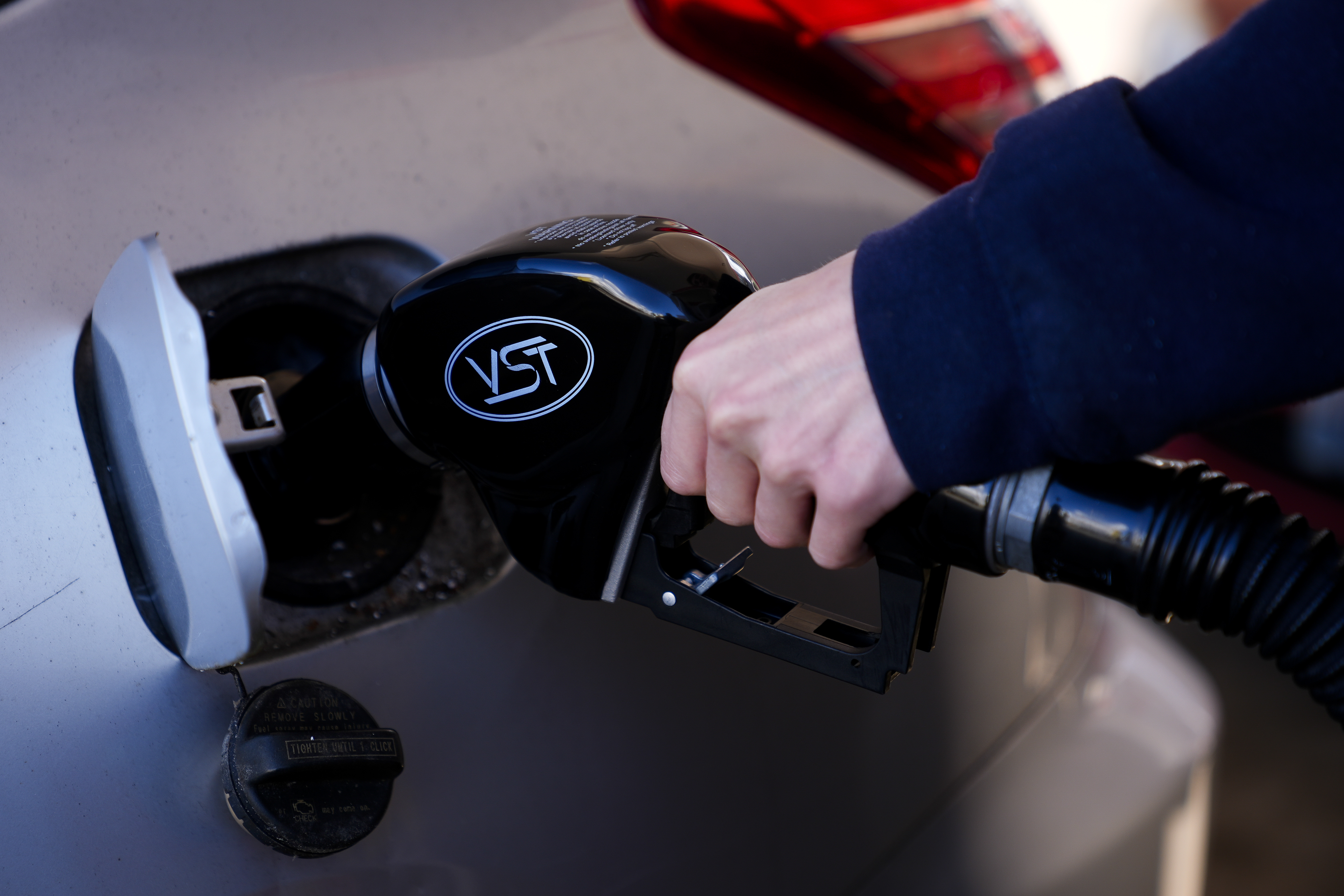 A driver fills up at a gasoline pump at a Shell gas station, Wednesday, Oct. 9, 2024, in Seattle. (AP Photo/Lindsey Wasson)