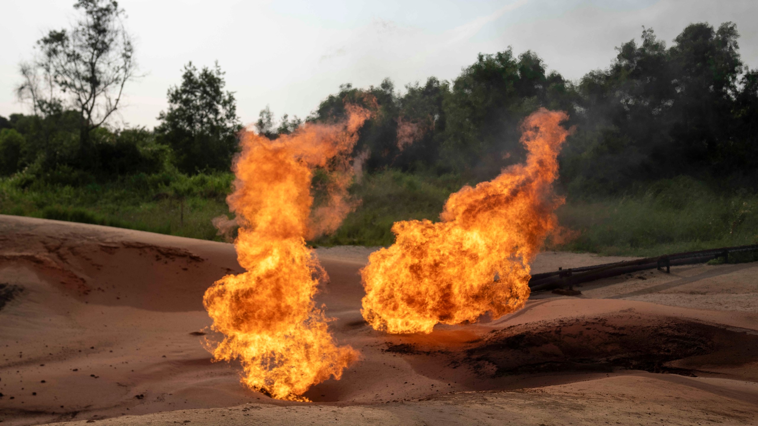 FILE—A burning flare is visible at an oil extraction area located in Moanda, Democratic Republic of the Congo, on Dec. 23, 2023. (AP Photo/Mosa'ab Elshamy, File)