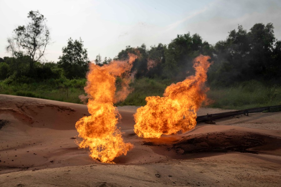 FILE—A burning flare is visible at an oil extraction area located in Moanda, Democratic Republic of the Congo, on Dec. 23, 2023. (AP Photo/Mosa'ab Elshamy, File)