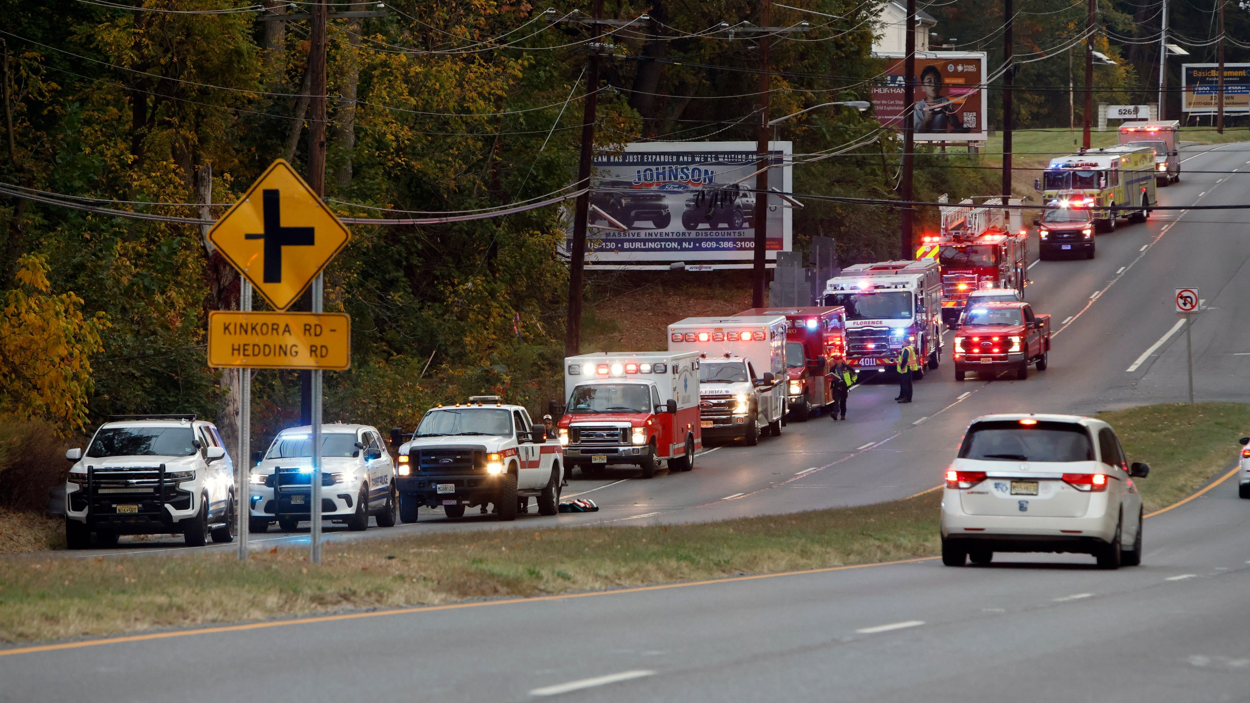 Fire and rescue personnel are on the scene of a train accident in Mansfield Twp., Burlington County, Monday, Oct. 14, 2024. (Alejandro A. Alvarez/The Philadelphia Inquirer via AP)