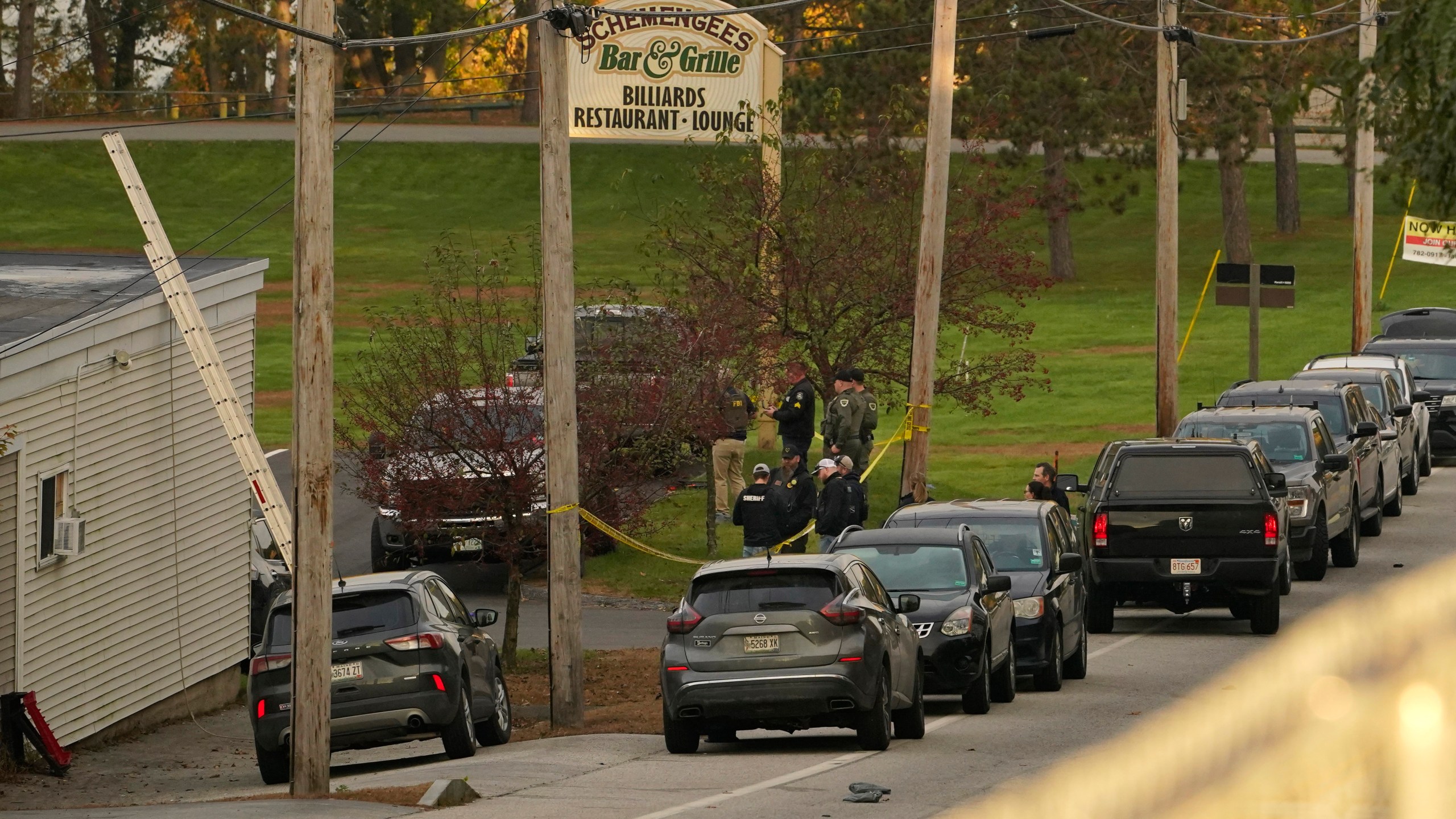 FILE - Law enforcement gather outside Schemengee's Bar and Grille, Thursday, Oct. 26, 2023, in Lewiston, Maine. (AP Photo/Robert F. Bukaty, File)