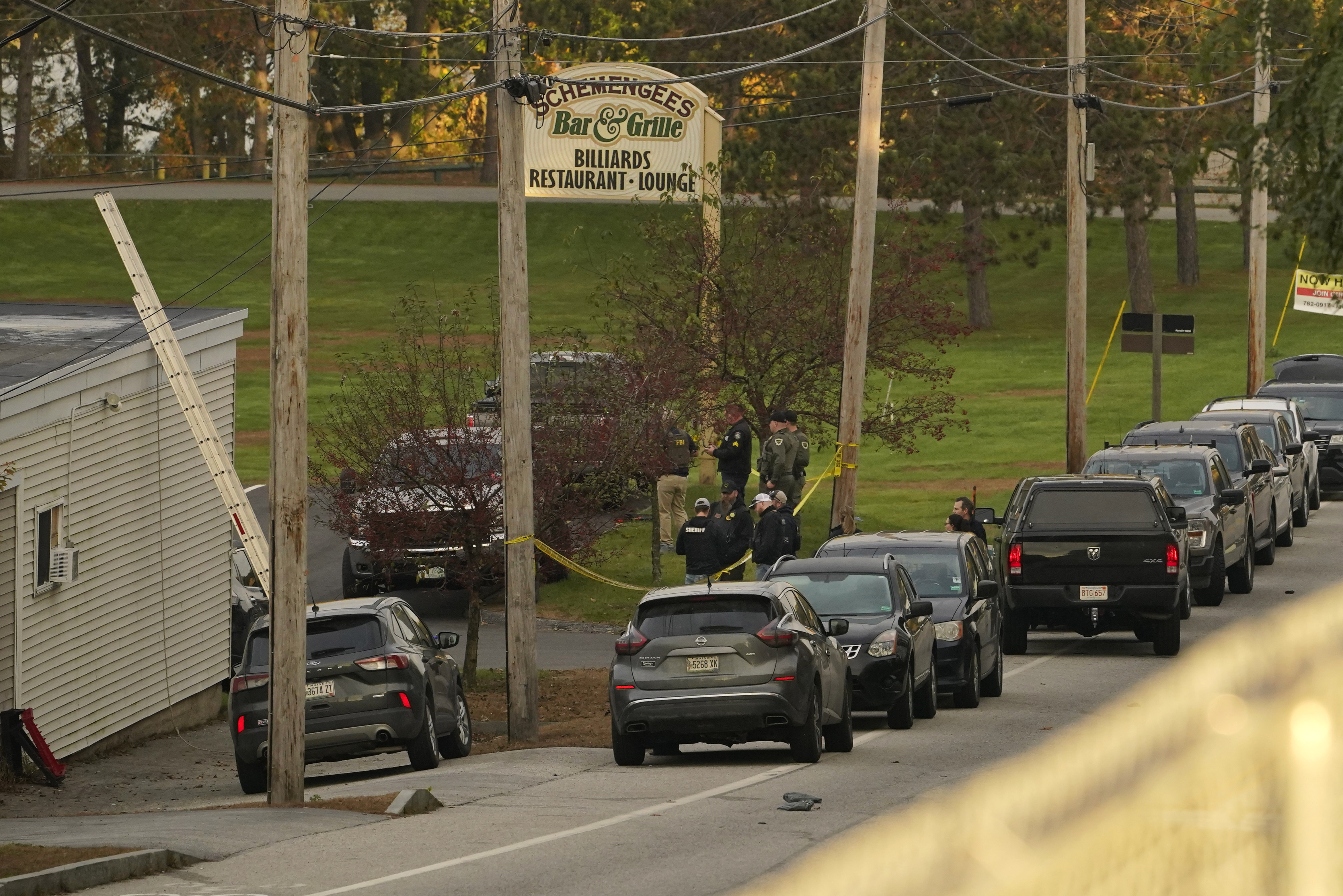 FILE - Law enforcement gather outside Schemengee's Bar and Grille, Thursday, Oct. 26, 2023, in Lewiston, Maine. (AP Photo/Robert F. Bukaty, File)