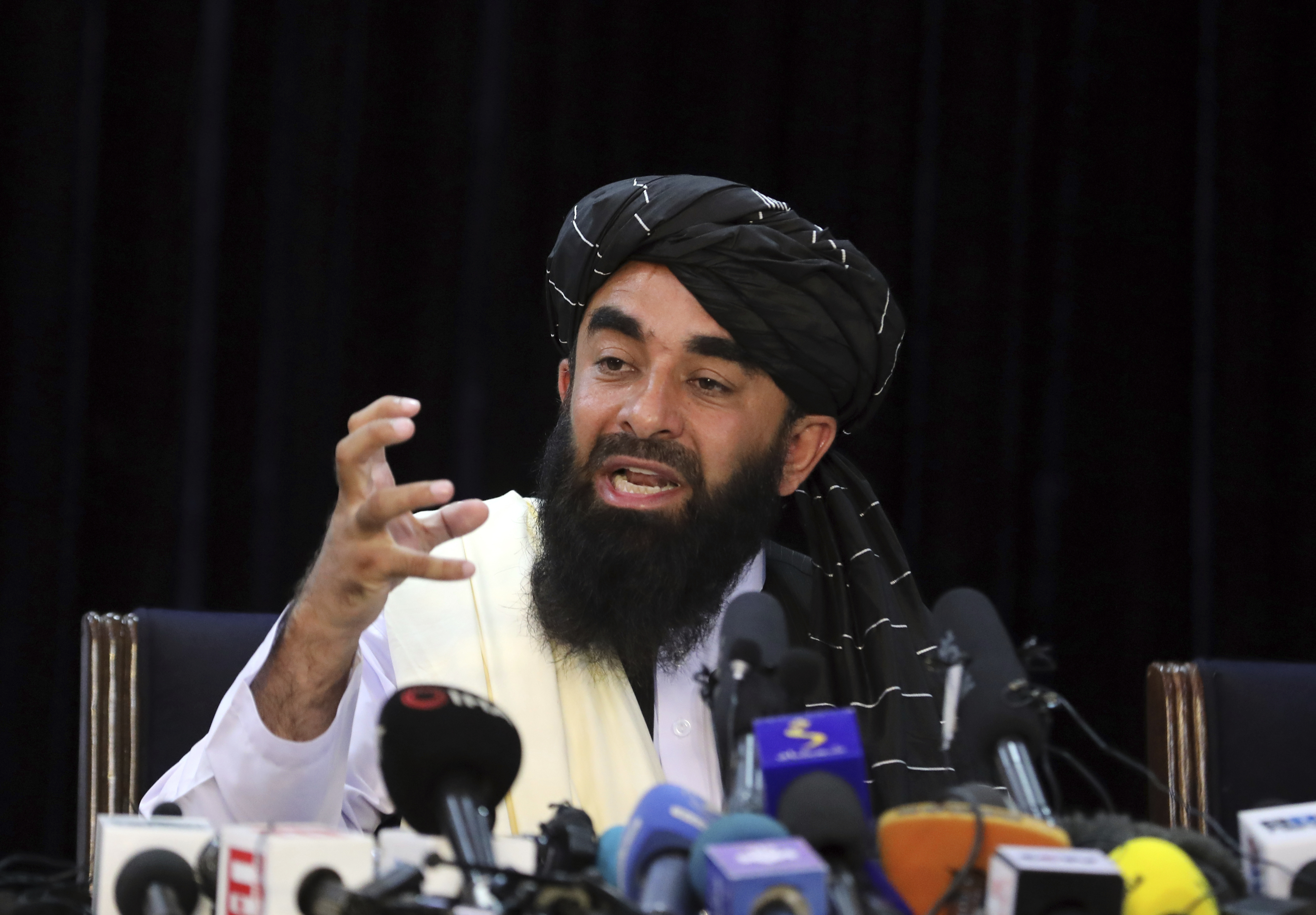 FILE - Taliban spokesman Zabihullah Mujahid speaks at his first news conference, in Kabul, Afghanistan, Tuesday, Aug. 17, 2021. (AP Photo/Rahmat Gul, File)