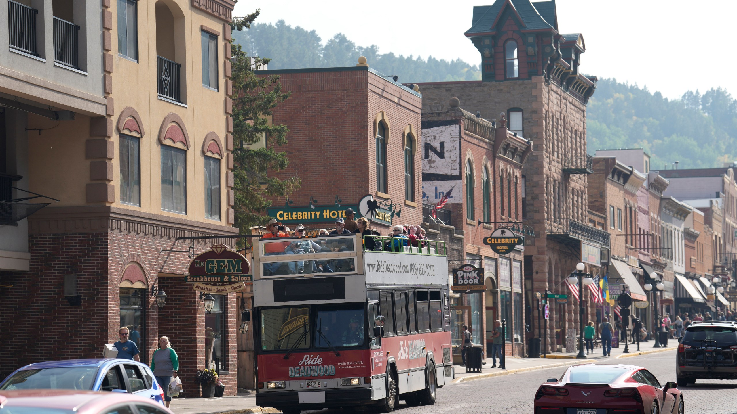 FILE - People walk along Main Street in Deadwood, S.D., Sept. 20, 2023. (AP Photo/David Zalubowski, File)