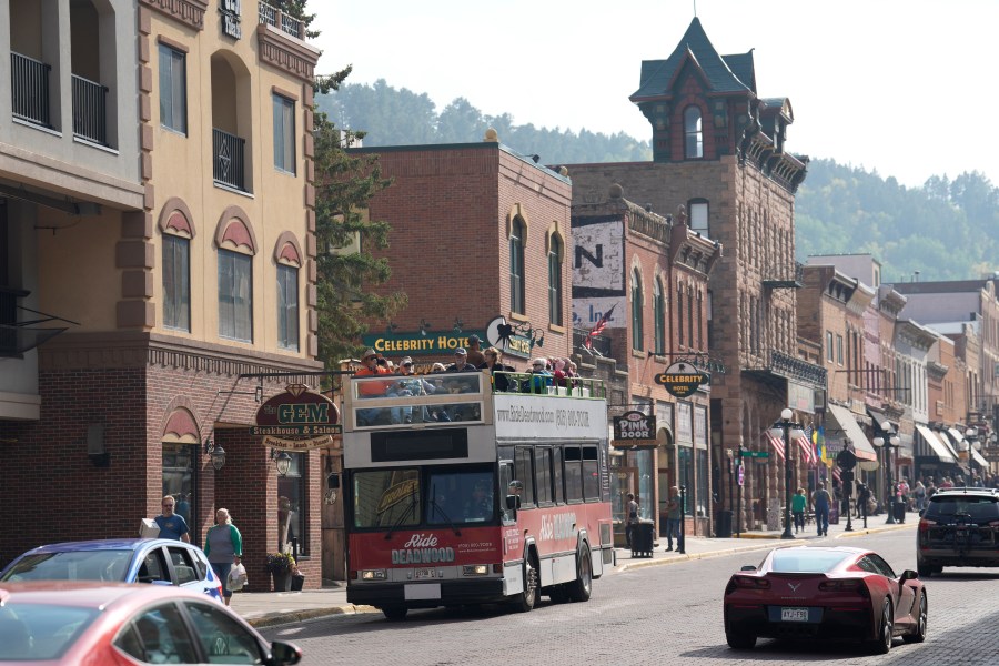 FILE - People walk along Main Street in Deadwood, S.D., Sept. 20, 2023. (AP Photo/David Zalubowski, File)