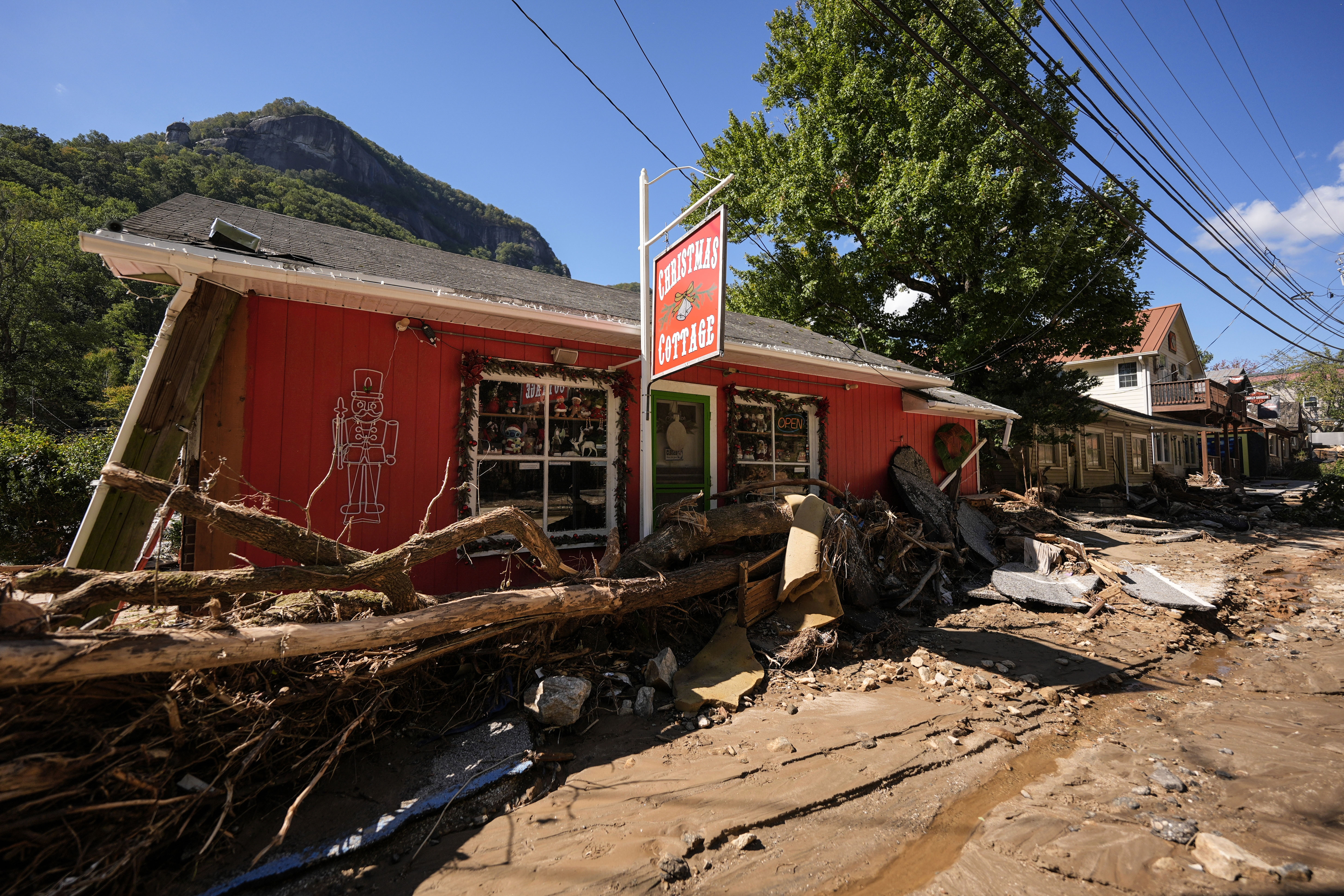 Businesses are seen in a debris field in the aftermath of Hurricane Helene, Wednesday, Oct. 2, 2024, in Chimney Rock Village, N.C. (AP Photo/Mike Stewart)