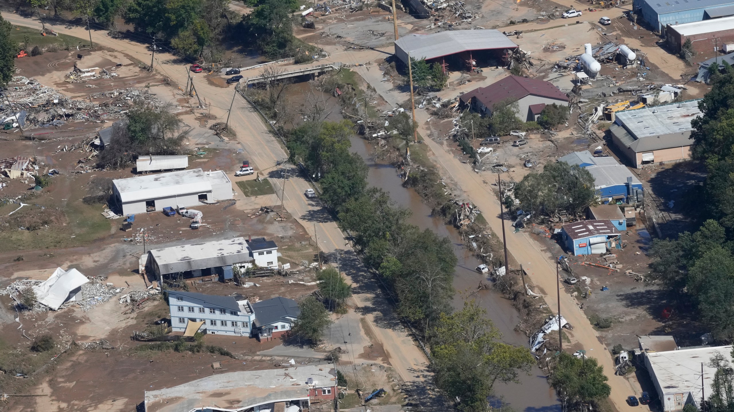 FILE - A view of damage in Asheville, N.C., is seen during an aerial tour with President Joe Biden who looked at areas impacted by Hurricane Helene near Asheville, N.C., Wednesday, Oct. 2, 2024. (AP Photo/Susan Walsh, File)