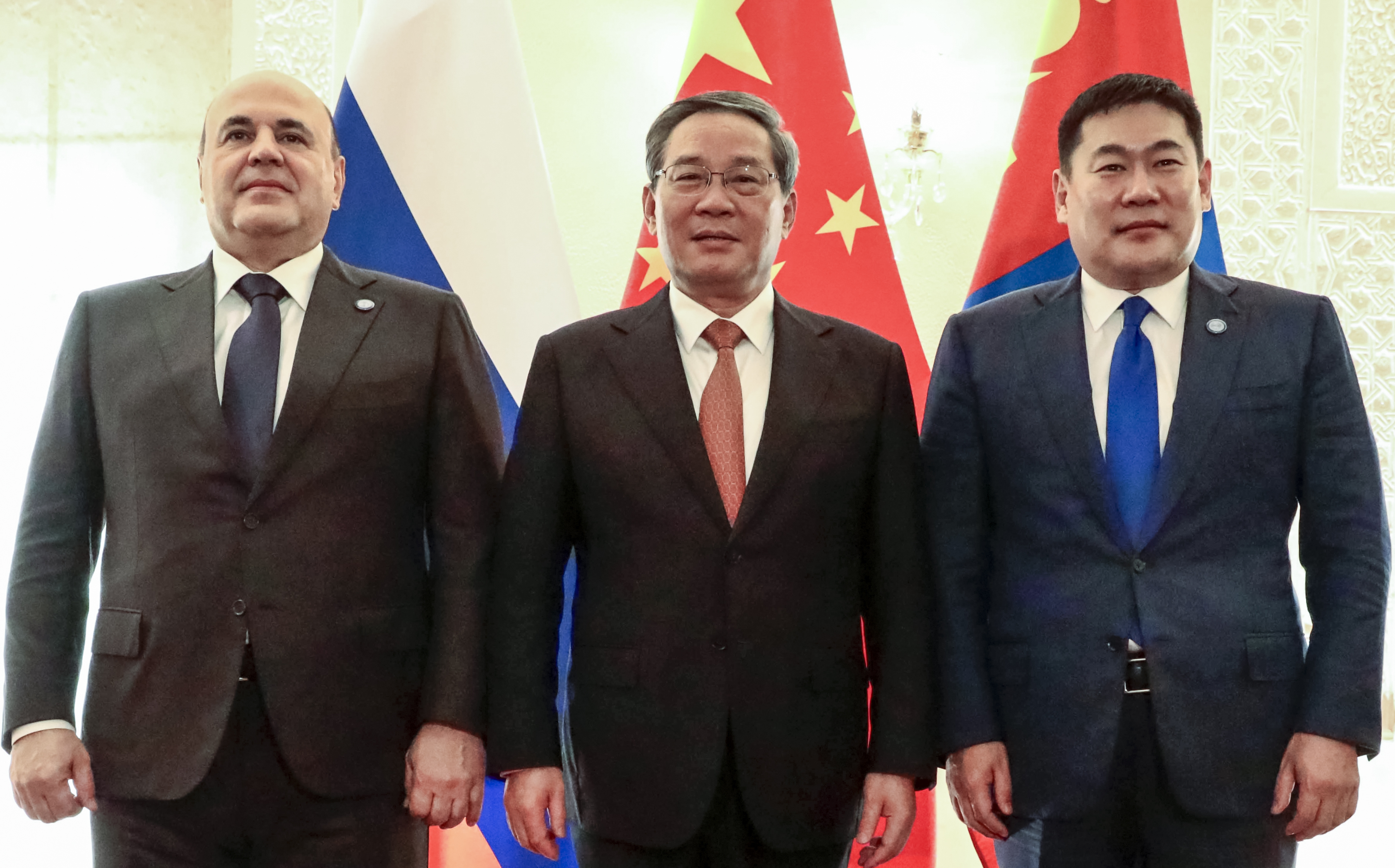 Russian Prime Minister Mikhail Mishustin, left, Chinese Premier Li Qiang, center, and Mongolian Prime Minister Luvsannamsrain Oyun-Erdene pose for a photo on the sidelines of the Shanghai Cooperation Organization (SCO) Council of Heads of Governments Summit in Islamabad, Pakistan, Wednesday, Oct. 16, 2024. (Roman Naumov, Sputnik, Government Pool Photo via AP)