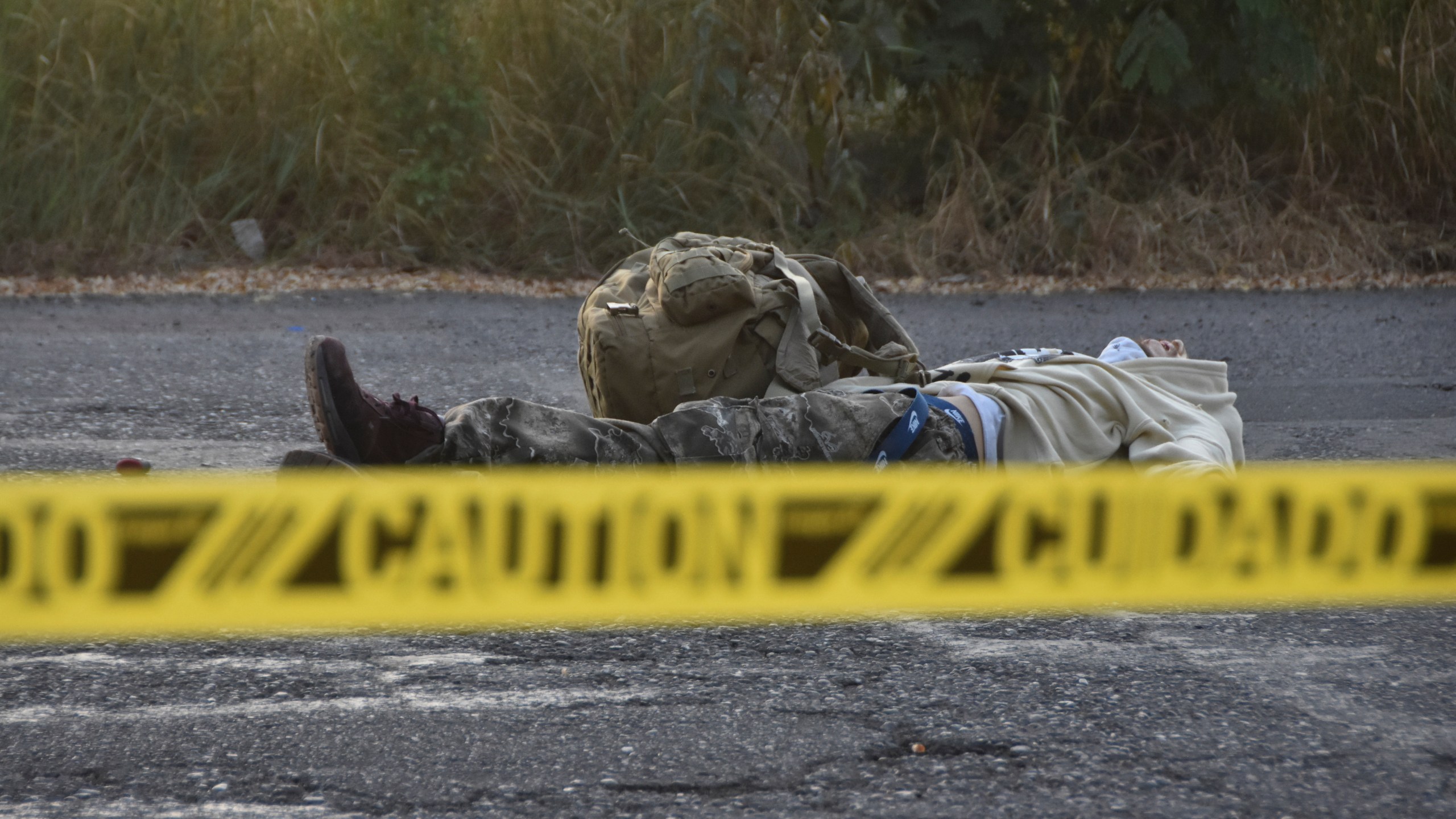 Caution tape surrounds a body lying on the street Culiacan, Sinaloa state, Mexico, Monday, Oct. 14, 2024. (AP Photo)