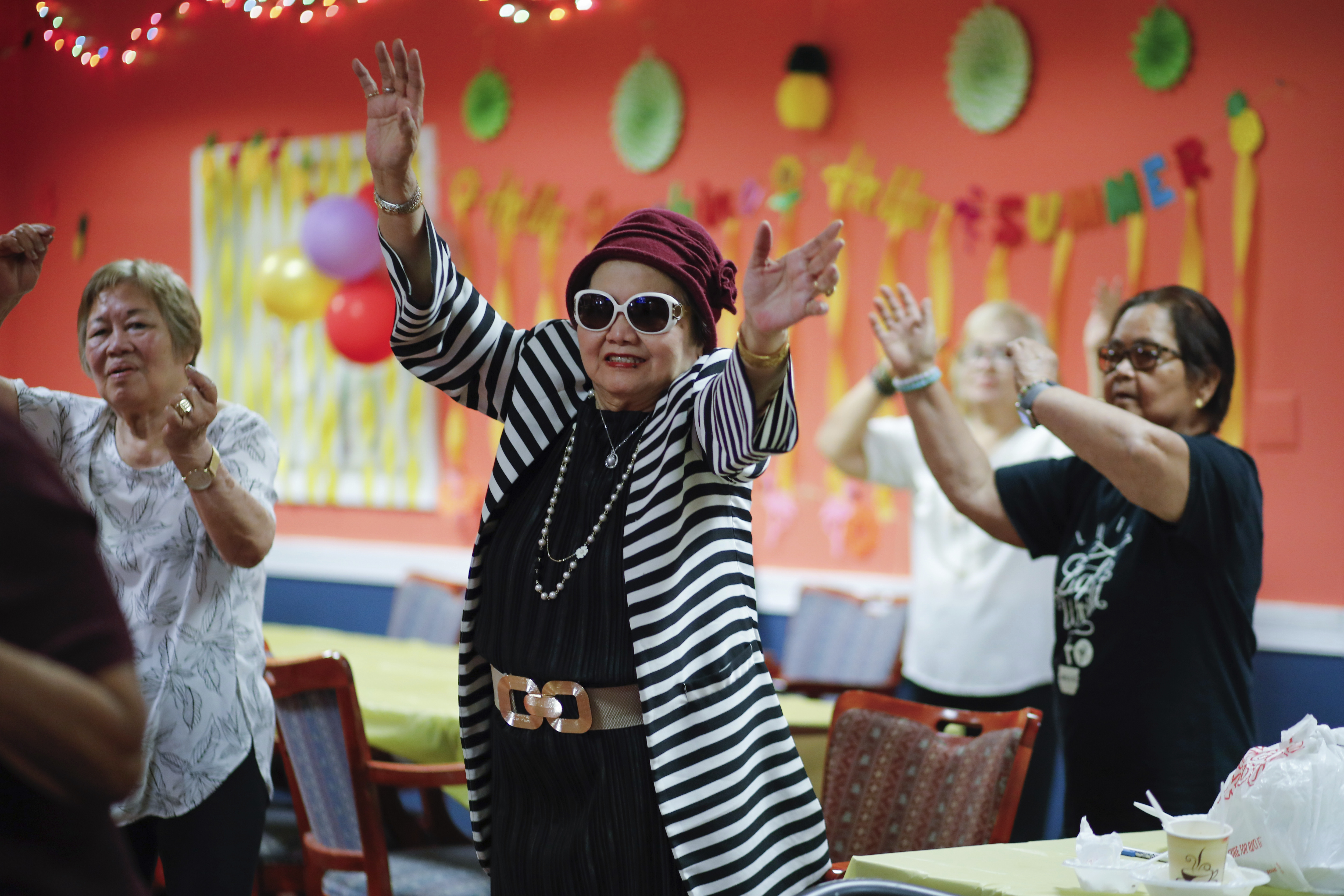 People attend a Zumba exercise class at Sunshine Adult Day Center in Bergenfield, N.J., Monday, Aug. 26, 2024. (AP Photo/Kena Betancur)