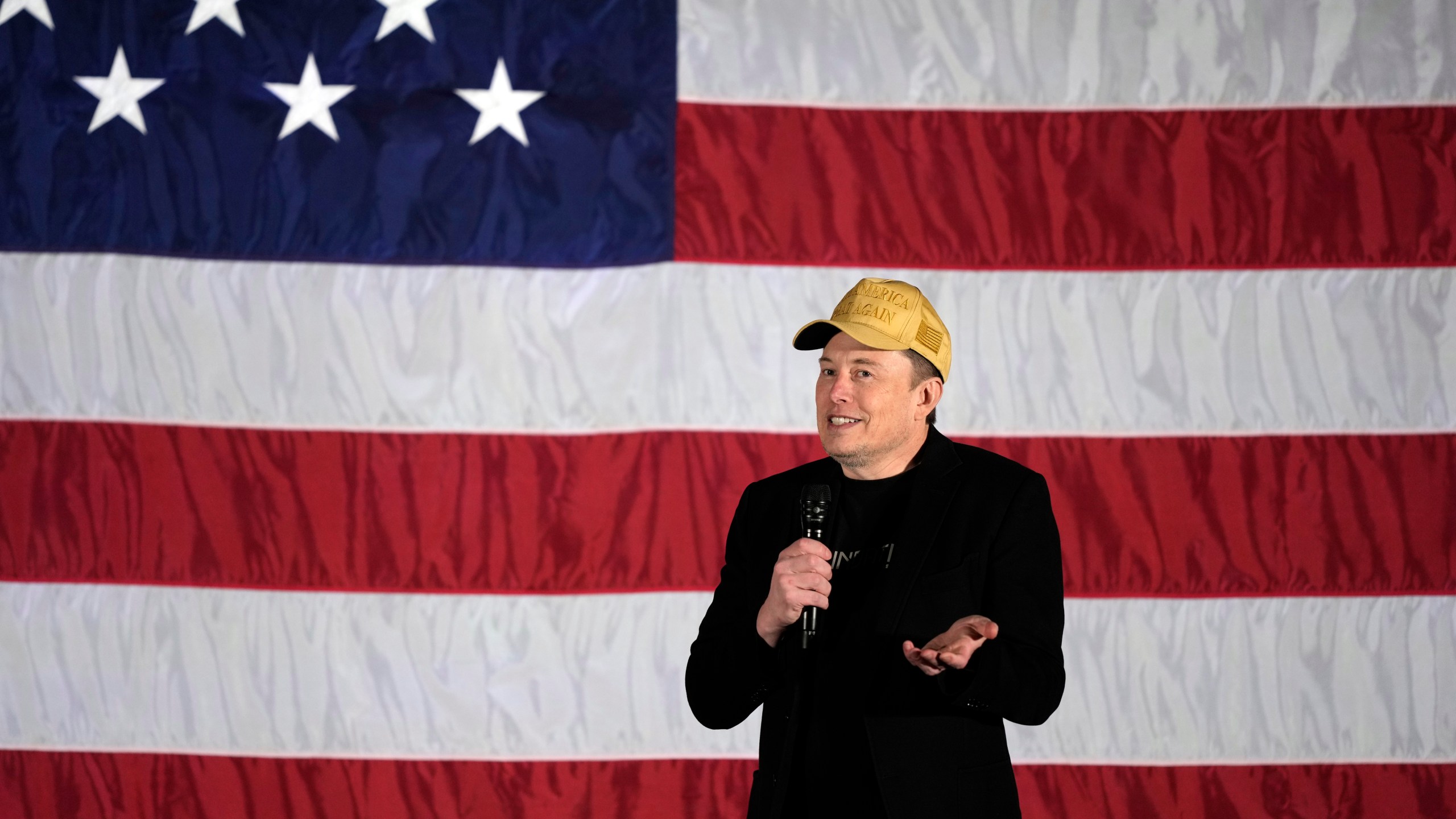 Elon Musk speaks as part of a campaign town hall in support of Republican presidential nominee former President Donald Trump in Folsom, Pa., Thursday, Oct. 17, 2024. (AP Photo/Matt Rourke)