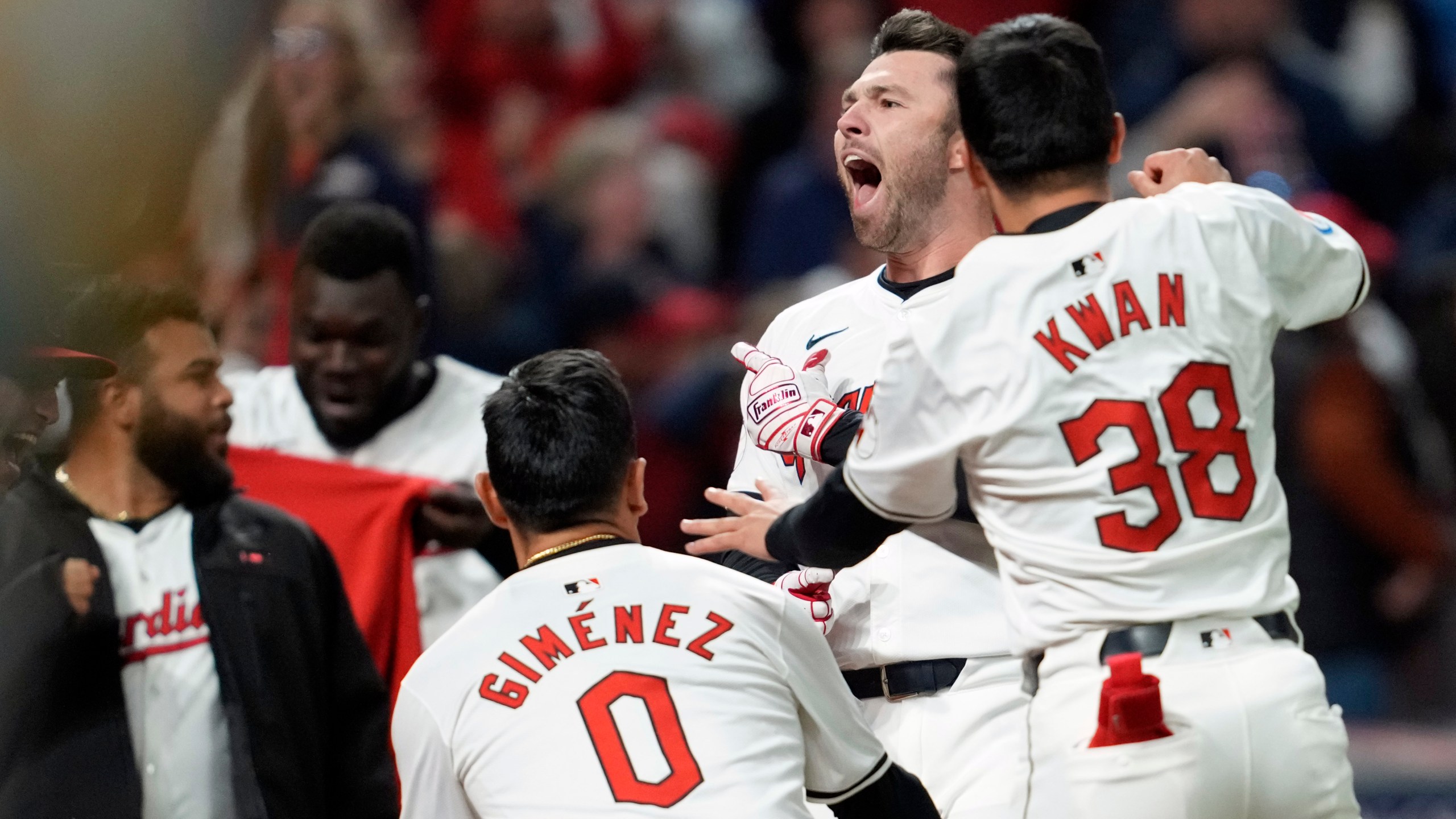 Cleveland Guardians' David Fry, second from right, celebrates with teammates after hitting a game-winning two-run home run against the New York Yankees during the 10th inning in Game 3 of the baseball AL Championship Series Thursday, Oct. 17, 2024, in Cleveland. The Guardians won 7-5. (AP Photo/Godofredo Vásquez )