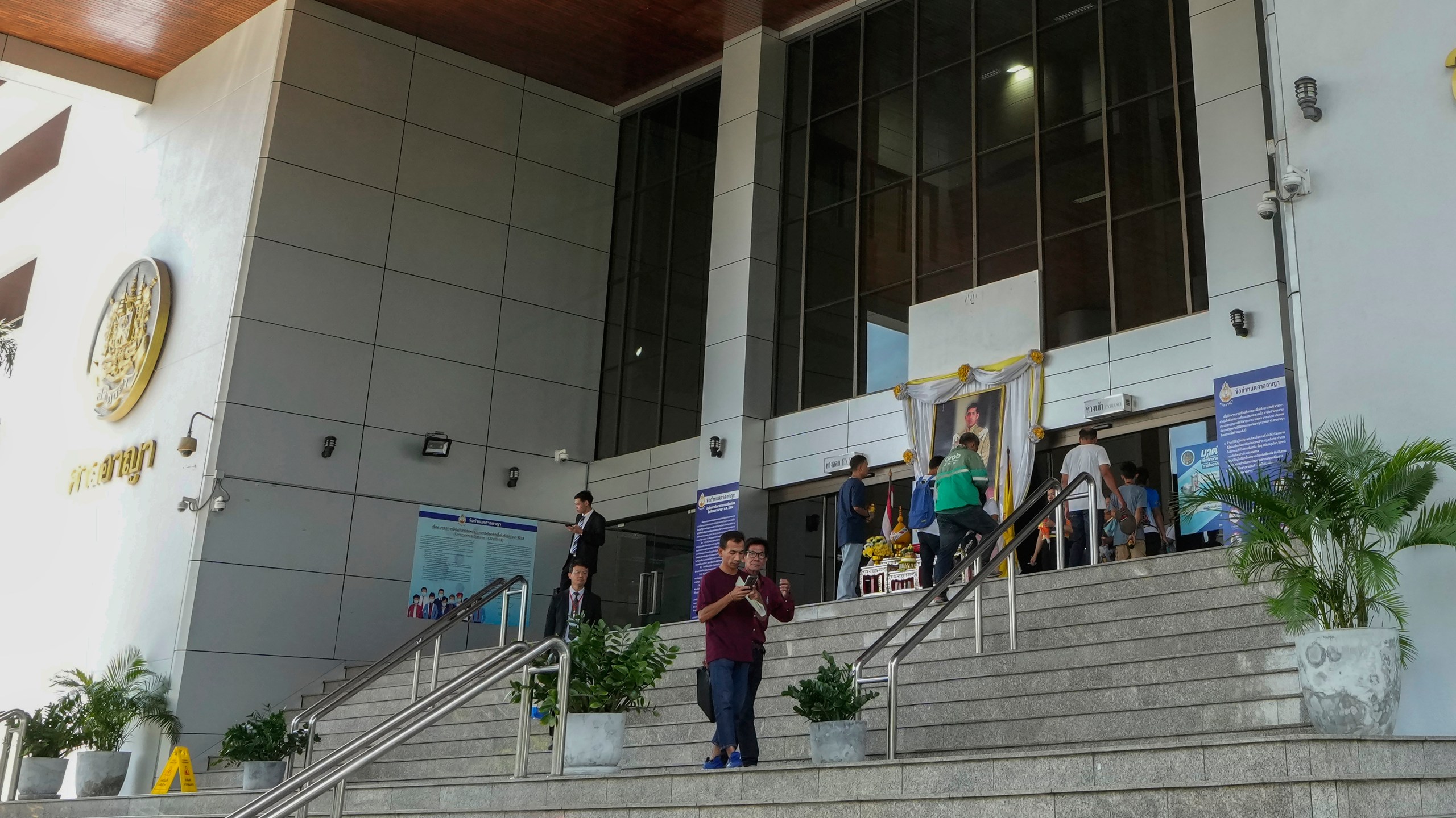 FILE - Peoples leave the Bangkok Criminal Court in Bangkok, Thailand, on Sept. 30, 2024. (AP Photo/Sakchai Lalit, File)