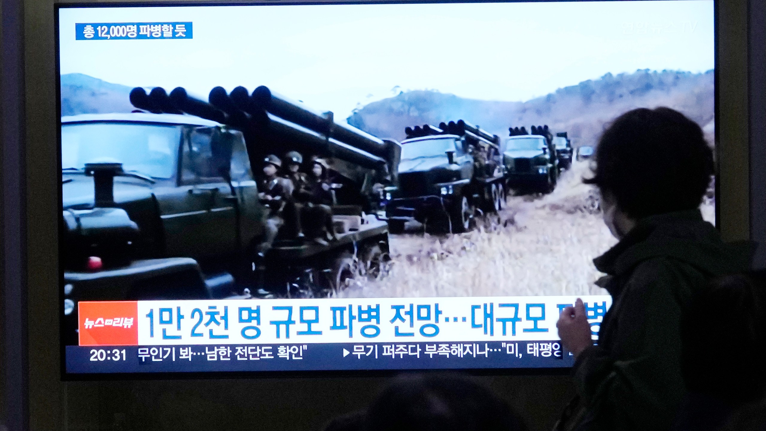 A TV screen shows file images of North Korean soldiers during a news program at Seoul Railway Station in Seoul, South Korea, Friday, Oct. 18, 2024. (AP Photo/Ahn Young-joon)