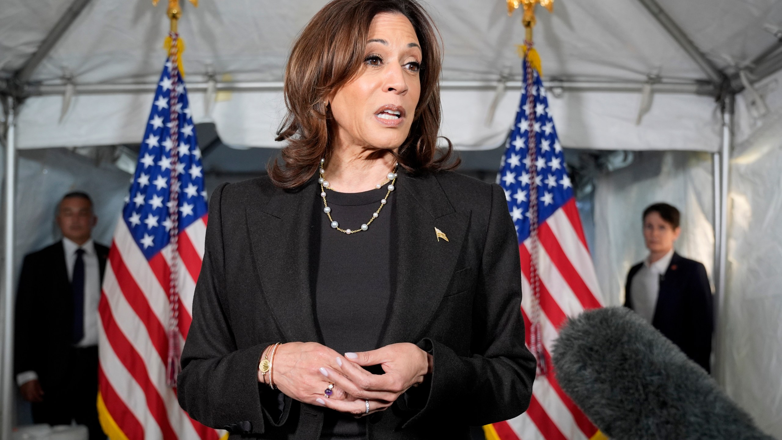 Democratic presidential nominee Vice President Kamala Harris speaks with reporters before a campaign event at Riverside Park in Grand Rapids, Mich., Friday, Oct. 18, 2024. (AP Photo/Jacquelyn Martin)