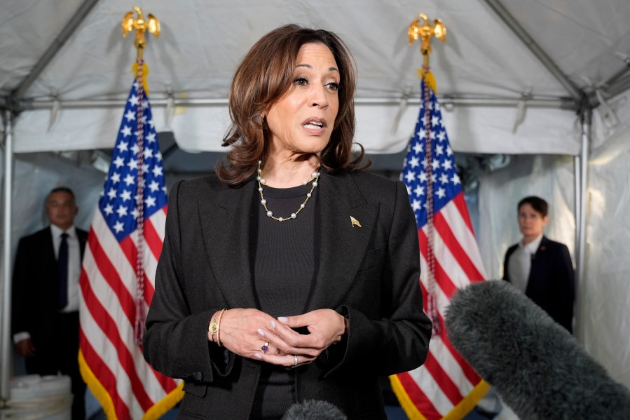 Democratic presidential nominee Vice President Kamala Harris speaks with reporters before a campaign event at Riverside Park in Grand Rapids, Mich., Friday, Oct. 18, 2024. (AP Photo/Jacquelyn Martin)