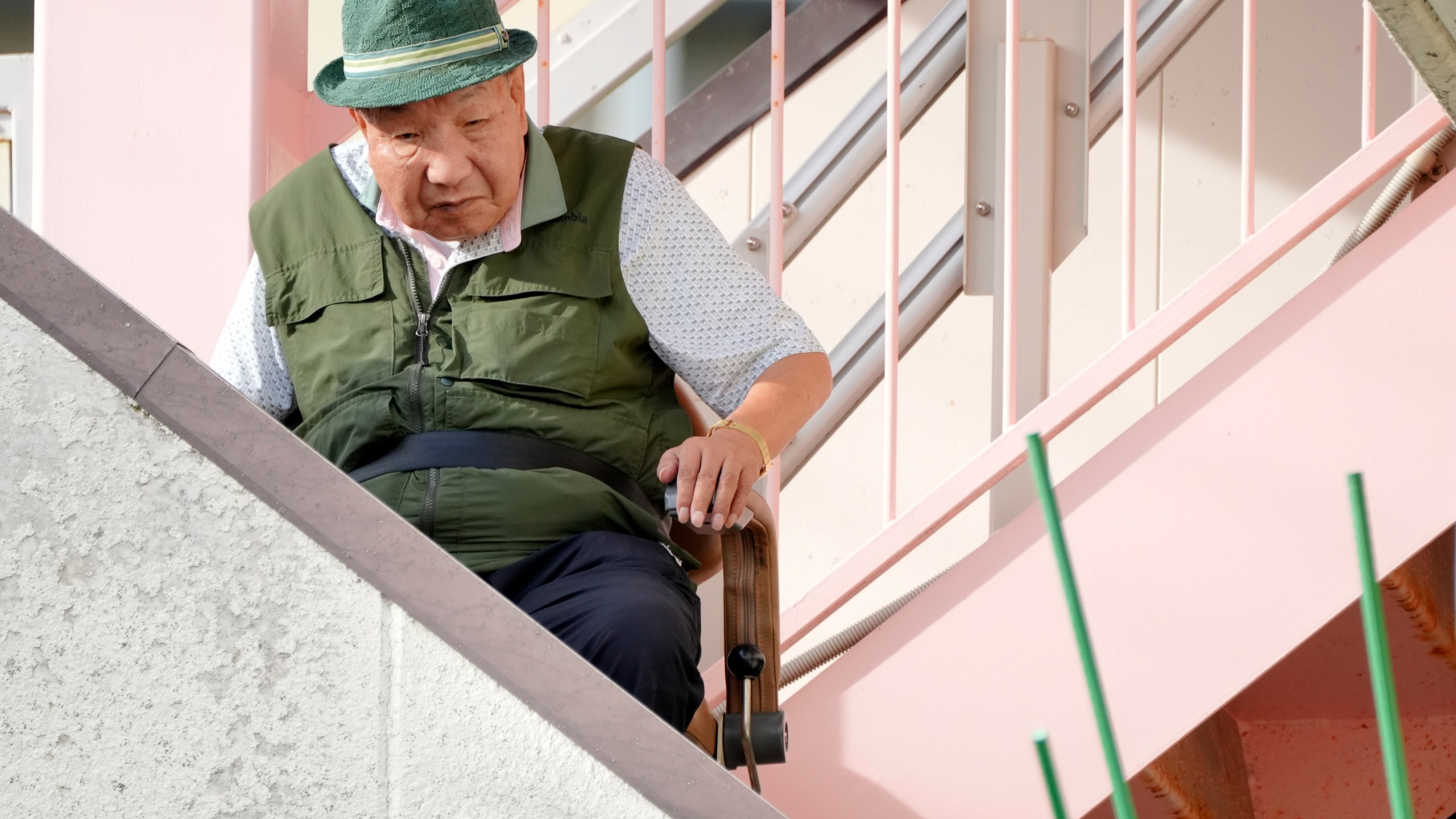 Iwao Hakamada, who was on death row for nearly a half-century and was acquitted last month by the Shizuoka District Court, prepares to go out for a walk in Hamamatsu, Shizuoka prefecture, central Japan, Thursday, Oct. 17, 2024. (AP Photo/Eugene Hoshiko)