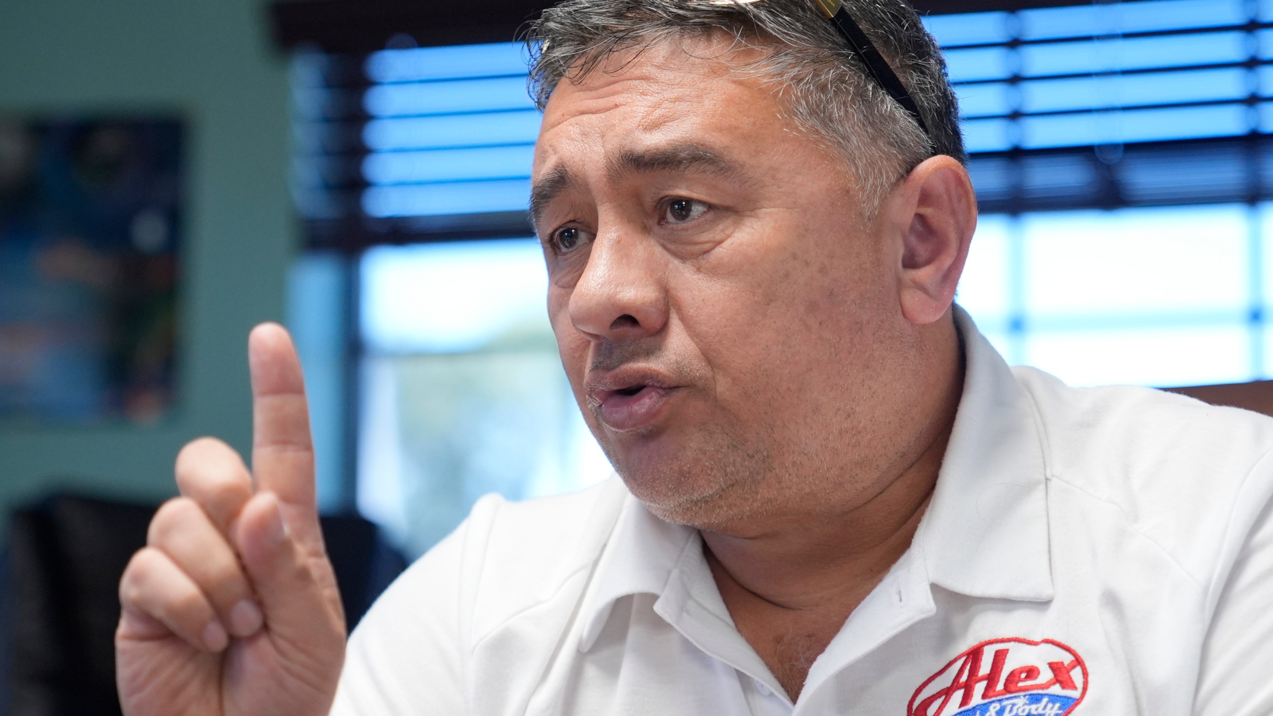 Alex Salguero talks about the 2024 presidential election during an interview at his business in Lewisville, Texas, Wednesday, Oct. 2, 2024. (AP Photo/LM Otero)