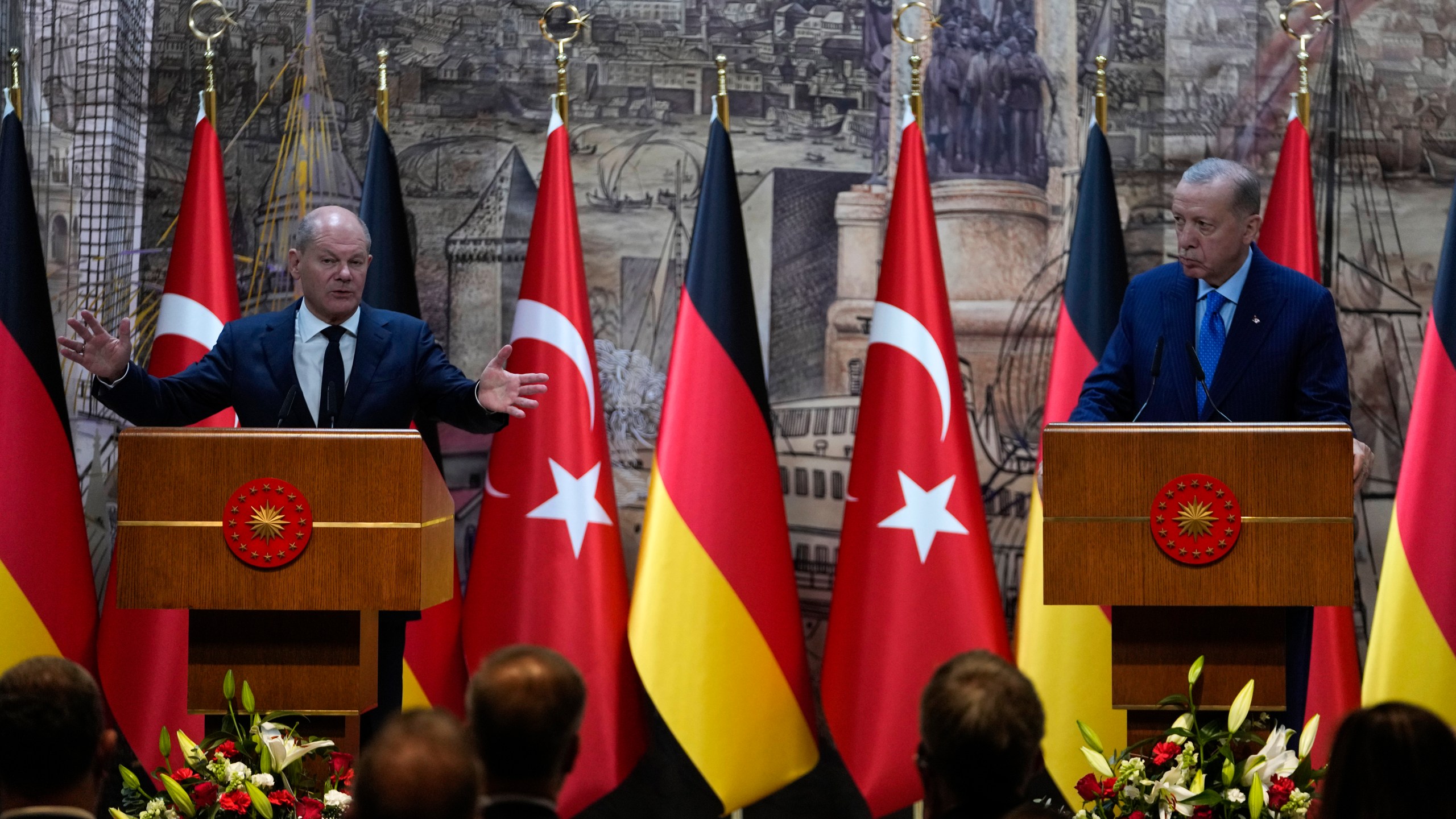 Turkey's President Recep Tayyip Erdogan, right, and Germany's Chancellor Olaf Scholz, answer journalists questions hold a presser in Istanbul, Turkey, Saturday, Oct. 19, 2024. (AP Photo/Khalil Hamra)