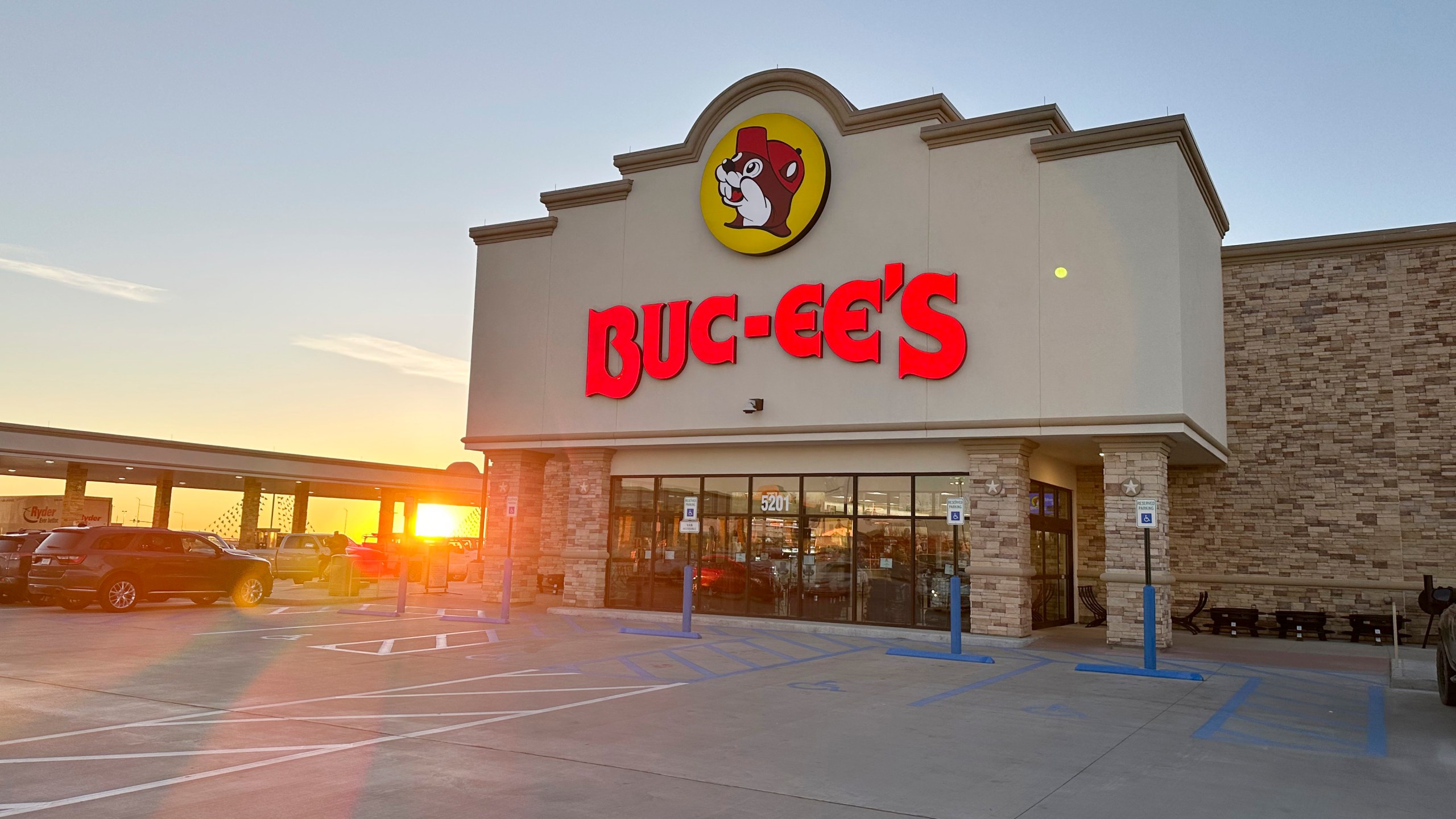 FILE - The sun rises beyond the gasoline pumps outside a Buc-ee's store on April 4, 2024, in Johnstown, Colo. (AP Photo/David Zalubowski, File)