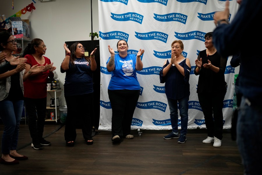 Erika Marquez, center, leads a meeting at the nonprofit Make the Road Nevada, where she works as the immigration and justice organizer, Thursday, Sept. 12, 2024, in Las Vegas. Marquez is a recipient of an Obama administration amnesty for immigrants brought to the U.S. illegally as children. (AP Photo/John Locher)