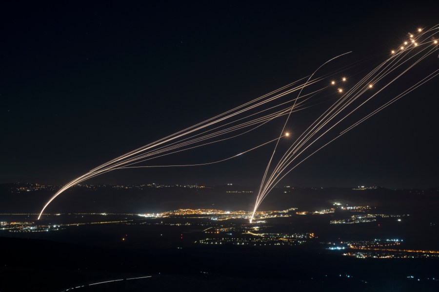 FILE - The Israeli Iron Dome air defense system fires to intercept an attack from Lebanon over the Galilee region as seen from the Israeli-annexed Golan Heights, on Aug. 4, 2024. (AP Photo/Leo Correa, File)