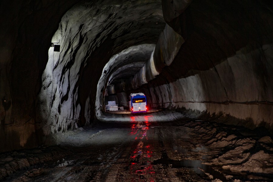 FILE -A bus carrying journalists takes a tour of the under construction Z-Morh tunnel in Sonamarg, northeast of Srinagar, Indian controlled Kashmir, Sept. 28, 2021. (AP Photo/Dar Yasin, File)