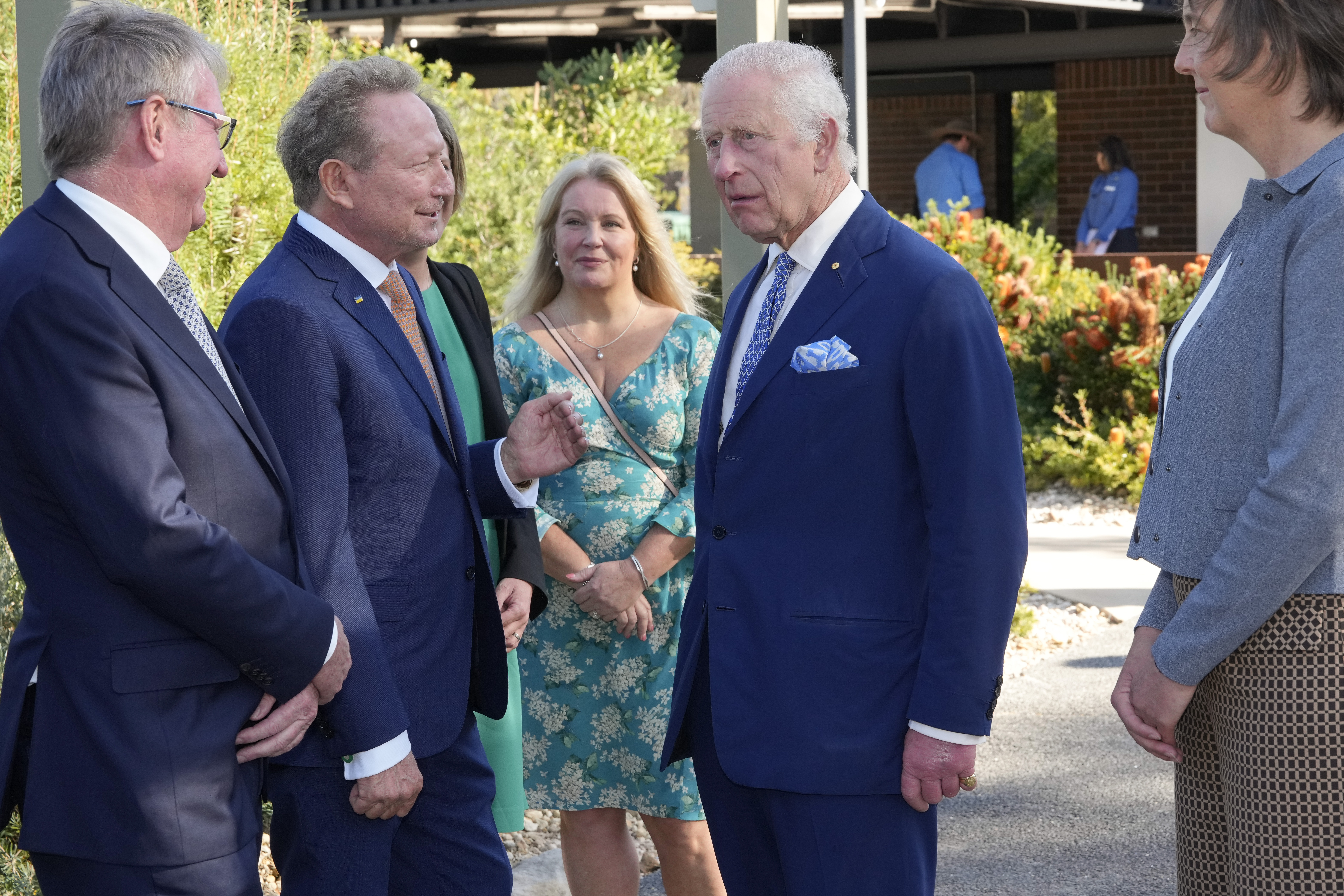 Britain's King Charles III, 2nd from right, talk with Australian Andrew Forrest, 2nd from left, before entering Australian National Botanic Gardens in Canberra, Monday, Oct. 21, 2024. (AP Photo/Mark Baker, Pool)