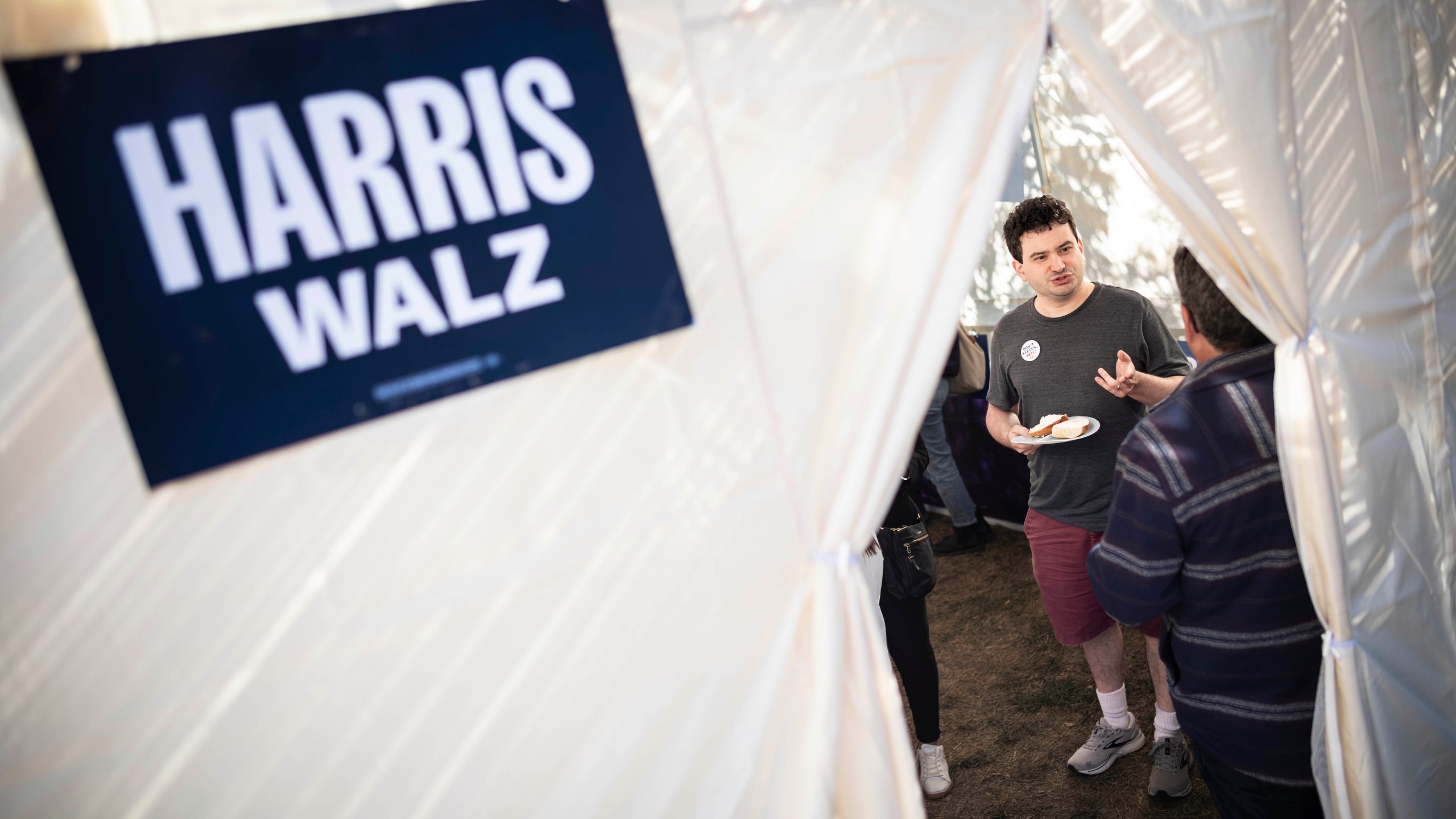 Adam Chaikof from Arlington, Va meets with other Kamala Harris supporters in a Sukkot in Bala Cynwyd, Pa on Sunday, Oct. 20, 2024. (AP Photo/Laurence Kesterson)