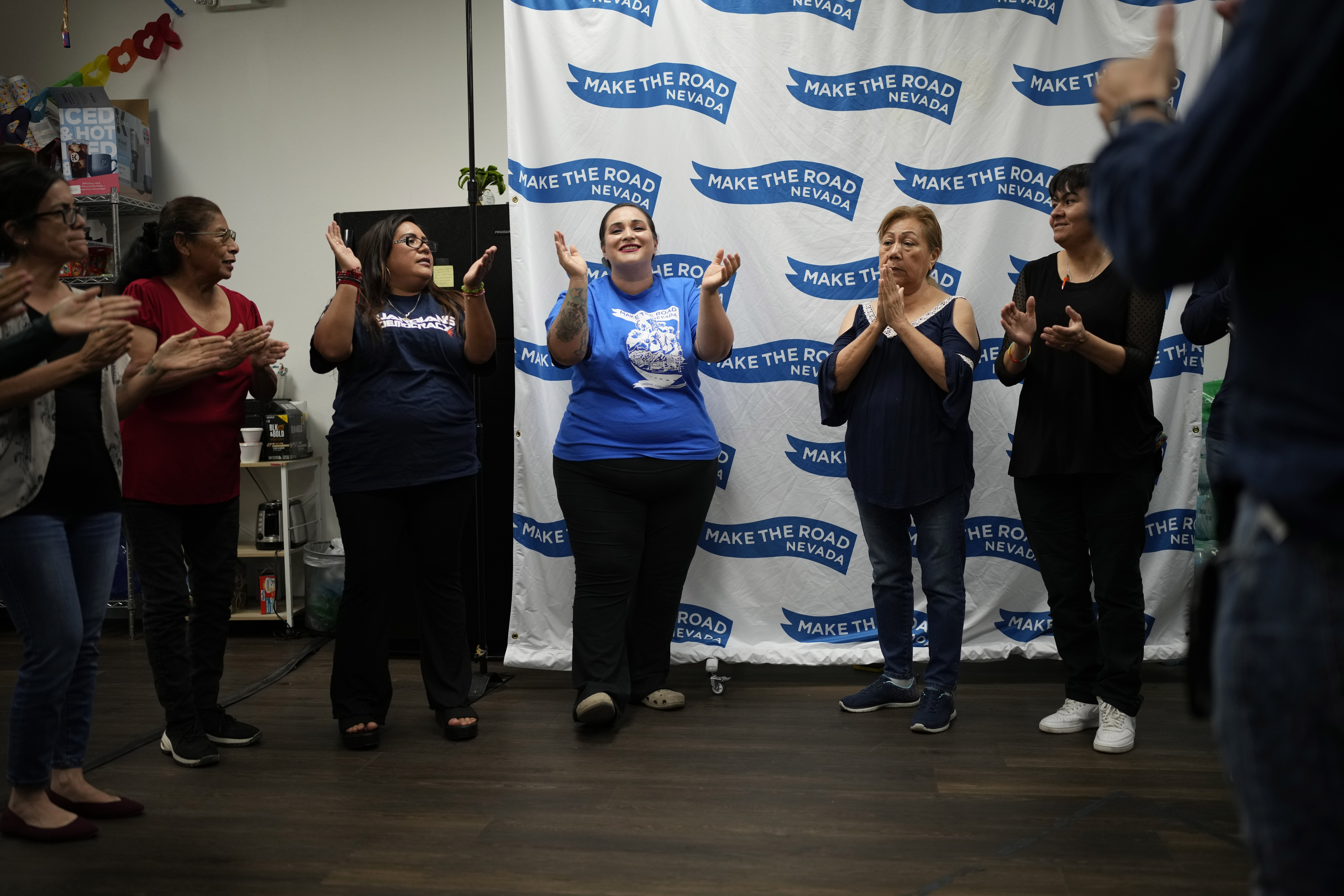 Erika Marquez, center, leads a meeting at the nonprofit Make the Road Nevada, where she works as the immigration and justice organizer, Thursday, Sept. 12, 2024, in Las Vegas. Marquez is a recipient of an Obama administration amnesty for immigrants brought to the U.S. illegally as children. (AP Photo/John Locher)