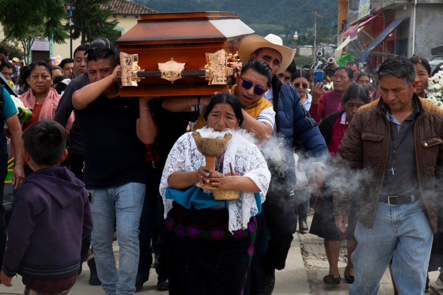 People carry the coffin of slain Catholic priest and activist Marcelo Pérez prior to a mass at the main plaza in San Andrés Larráinzar, Chiapas state, Mexico, Monday, Oct. 21, 2024. (AP Photo/Isabel Mateos)